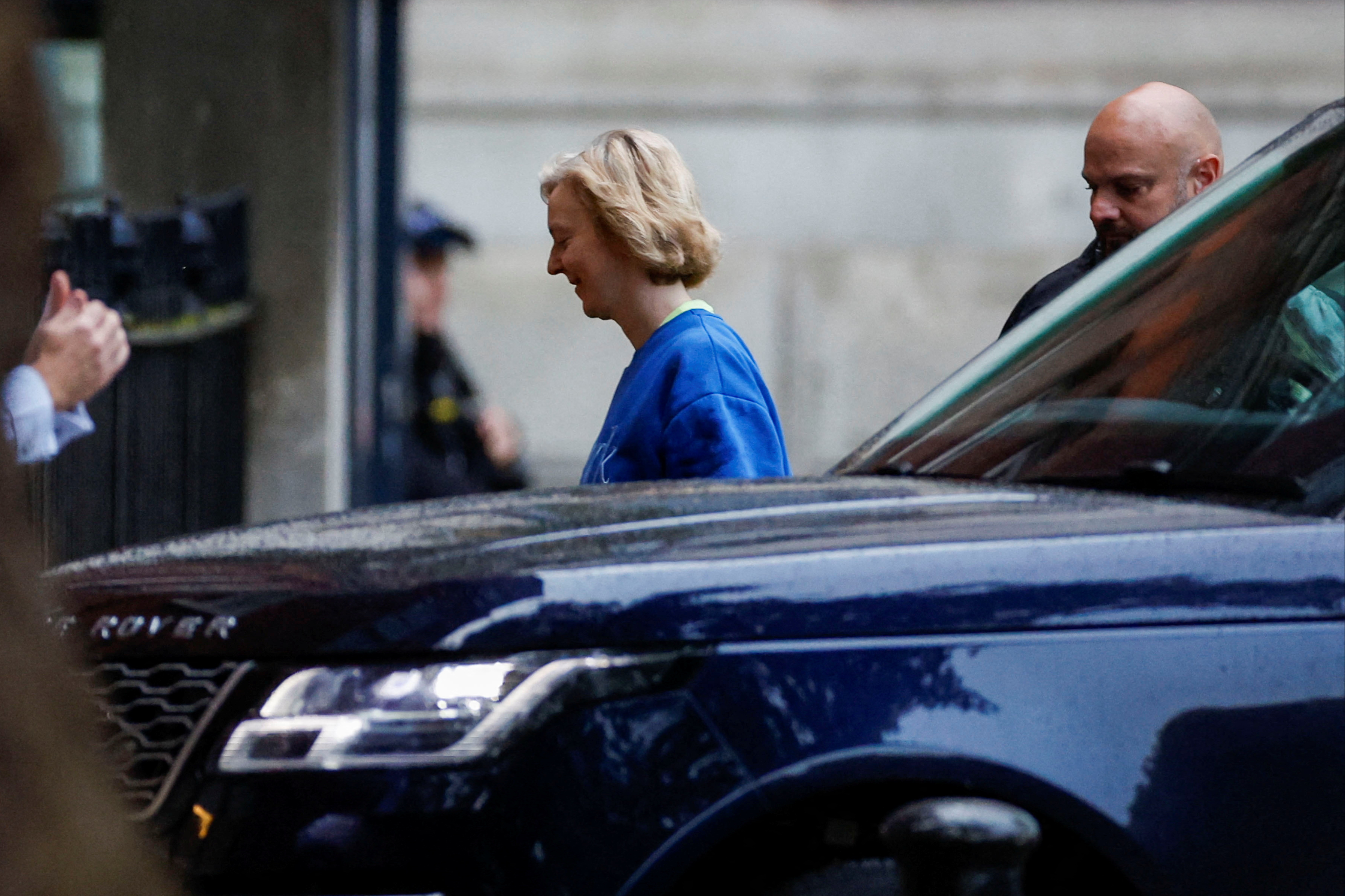 Liz Truss walks at Downing Street