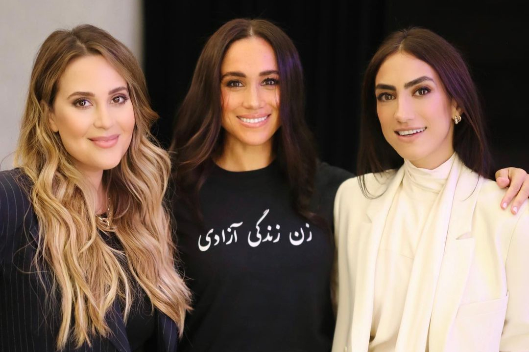 11330473 Meghan Markle make surprise appearance at Spotify headquarters to give speech on women's issues - with two Iranian execs at her charity in tow: Duchess also wears shirt emblazoned with pro-protest message in Farsi 