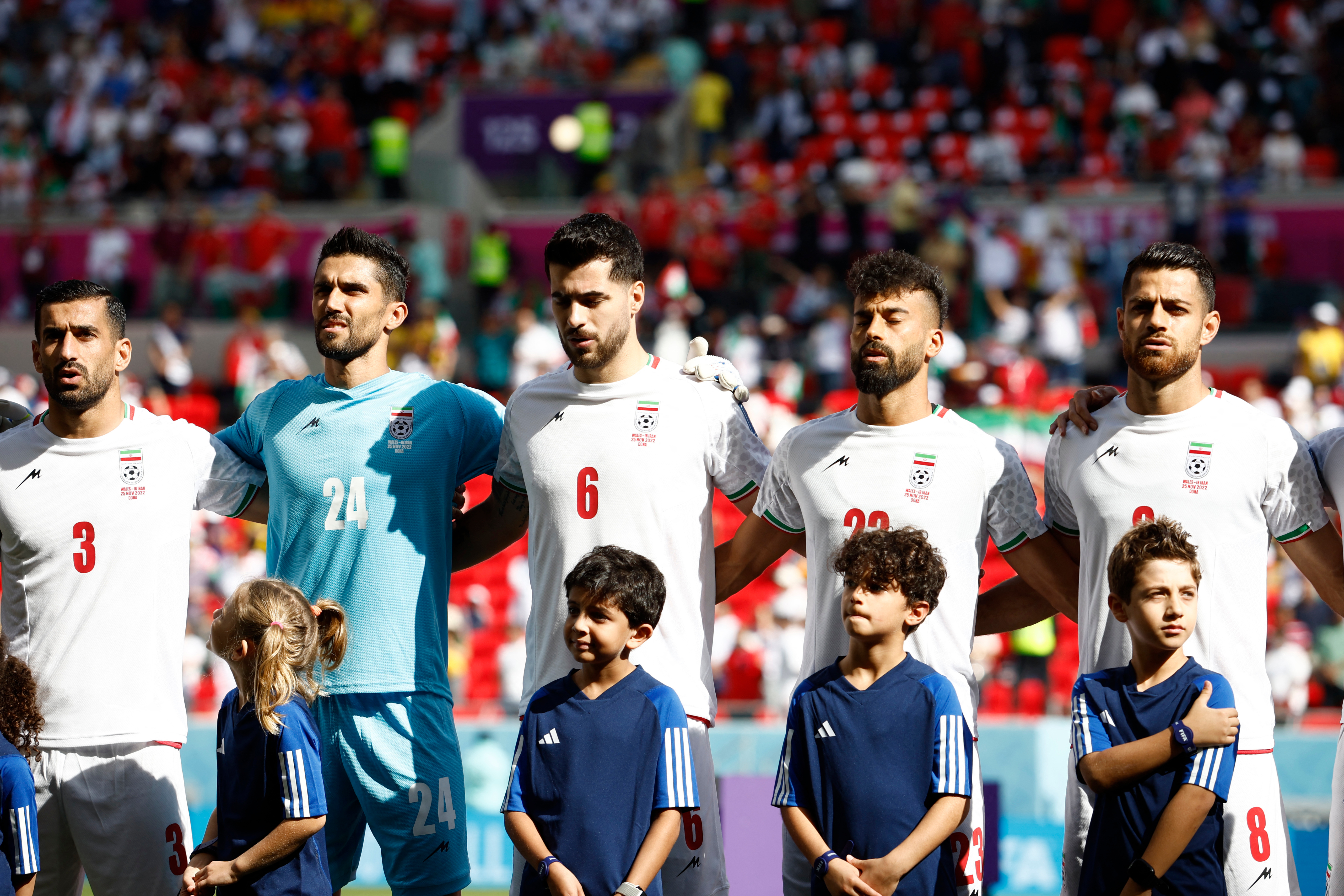 Iran players sing national anthem ahead of Wales game as protestors confronted outside