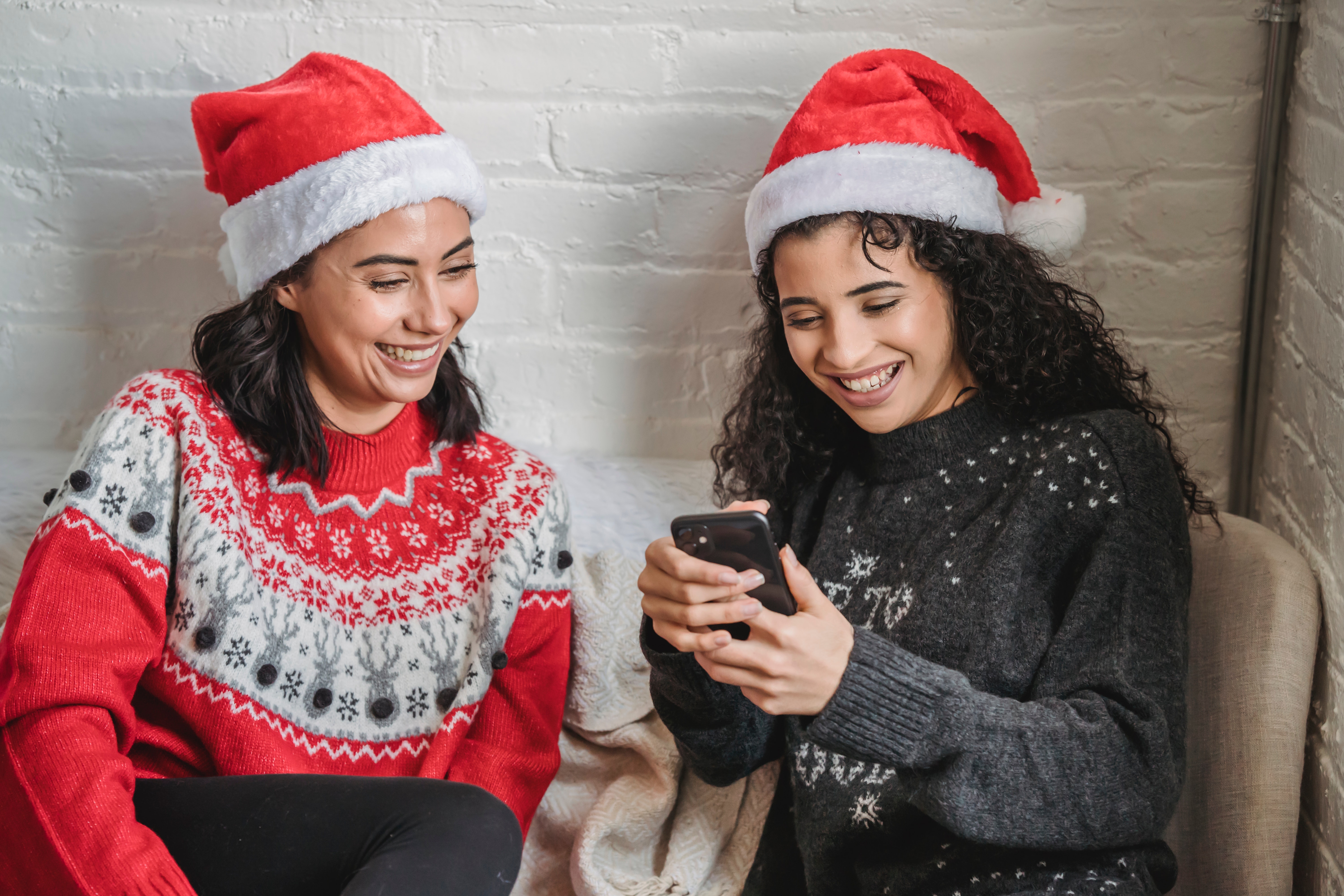 Festively dressed friends laughing 