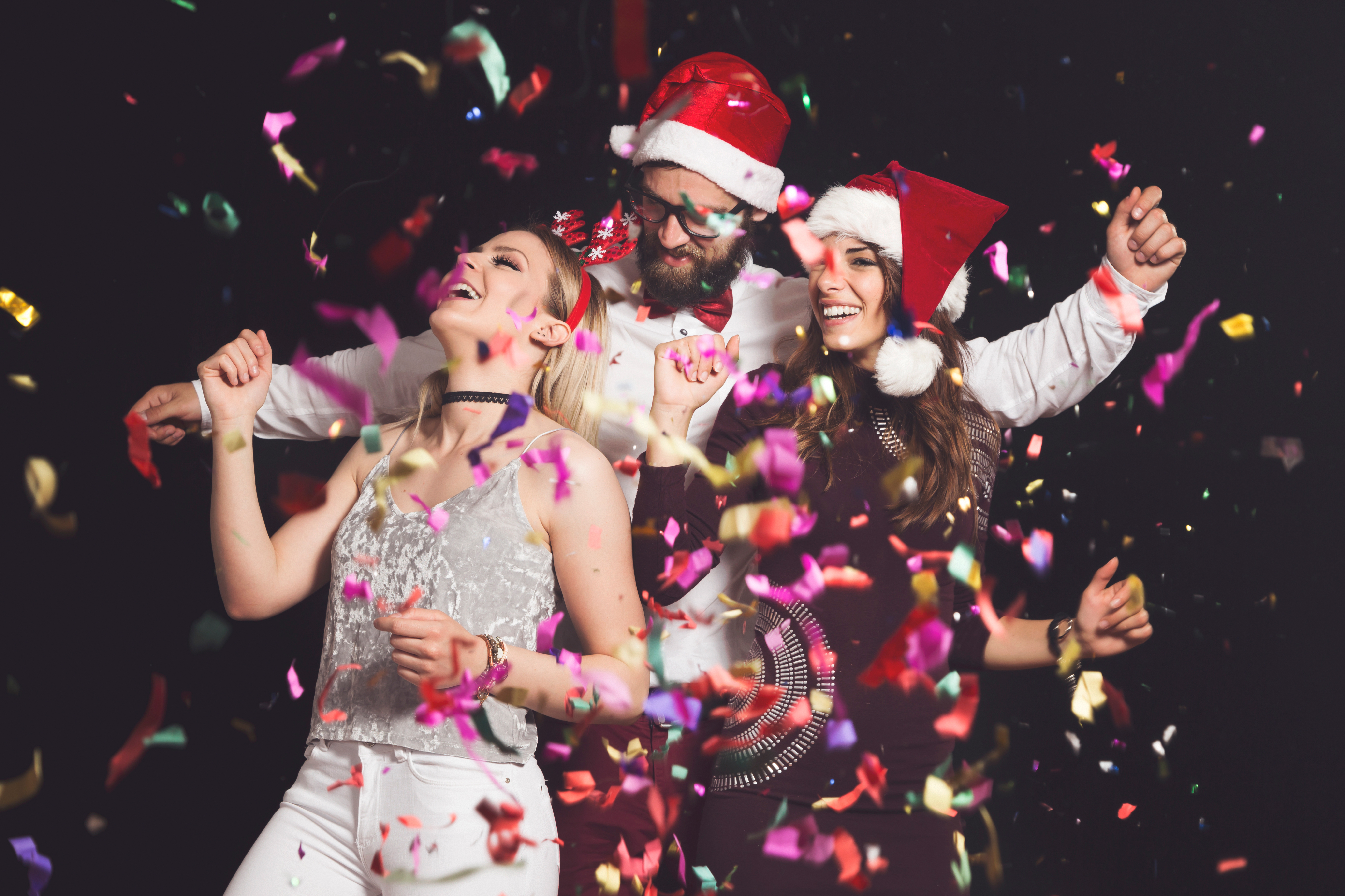 Three,Young,People,Having,Fun,And,Dancing,At,New,Year's