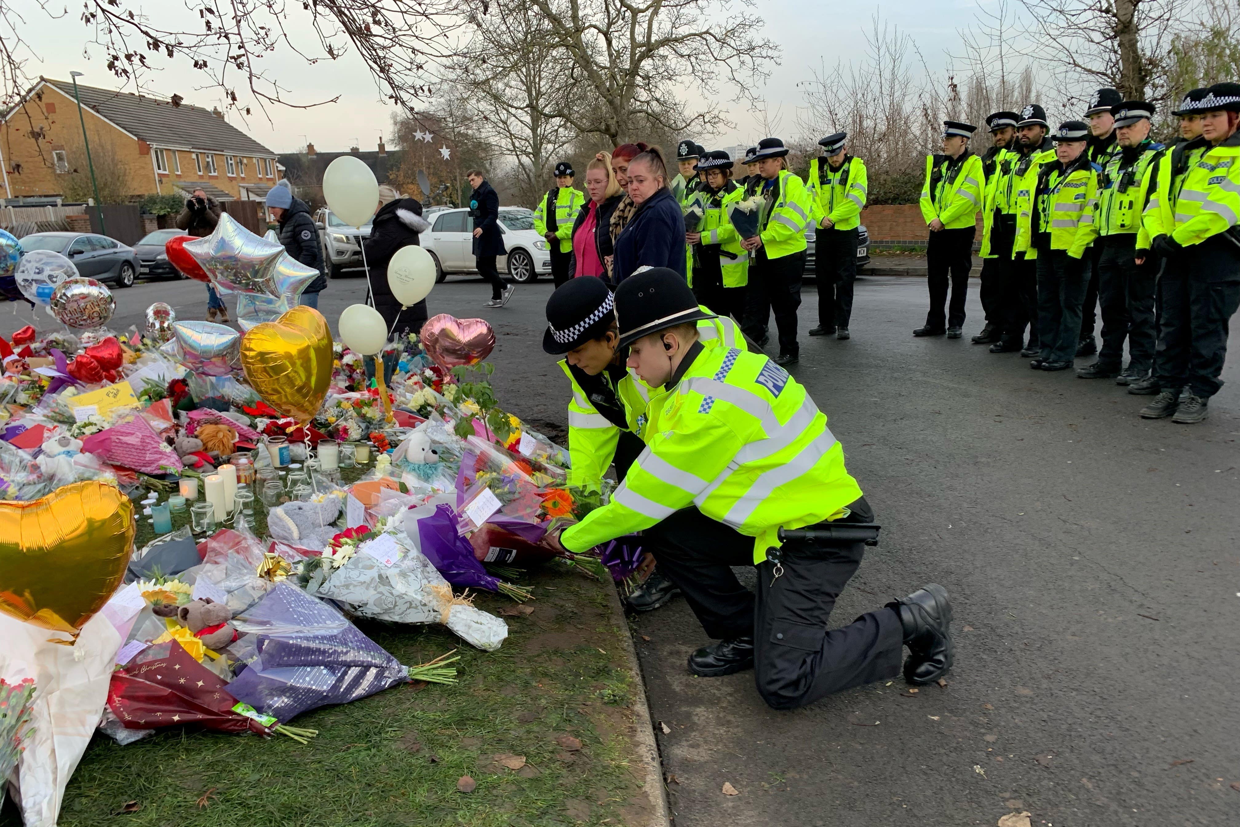 Tearful police pay silent tribute to boys who died in ice-covered lake tragedy