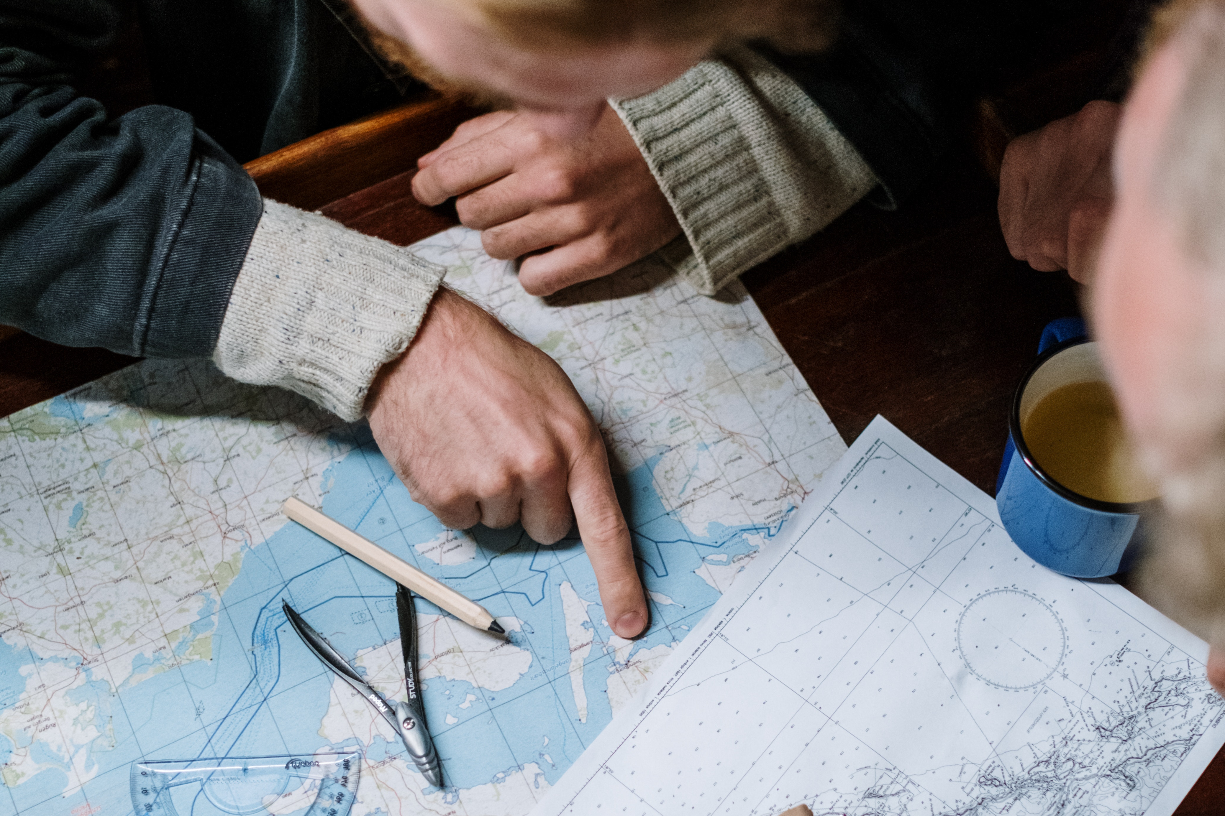 person pointing at a map 