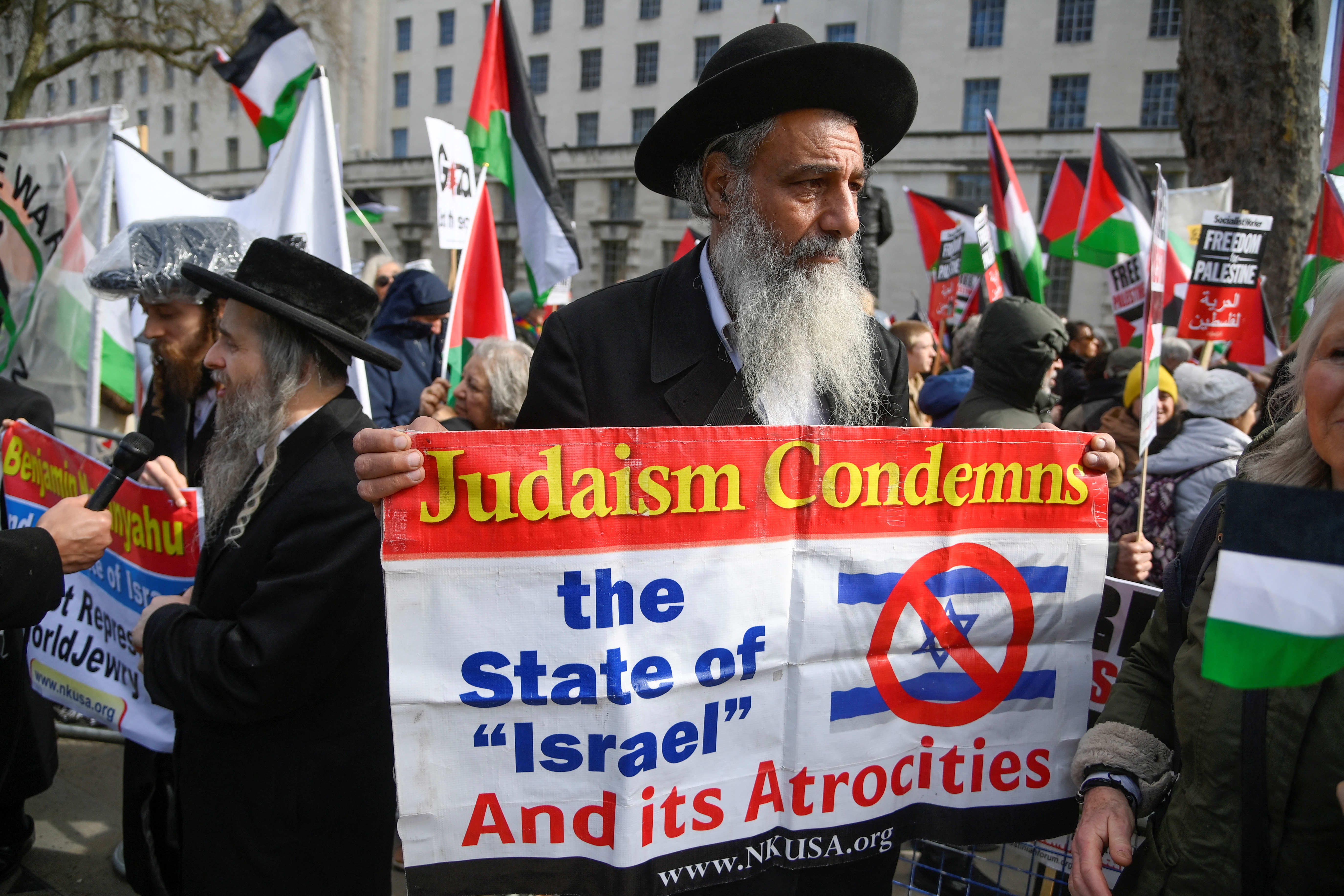 Demonstrators protest against Israeli Prime Minister Benjamin Netanyahu during his visit to Britain