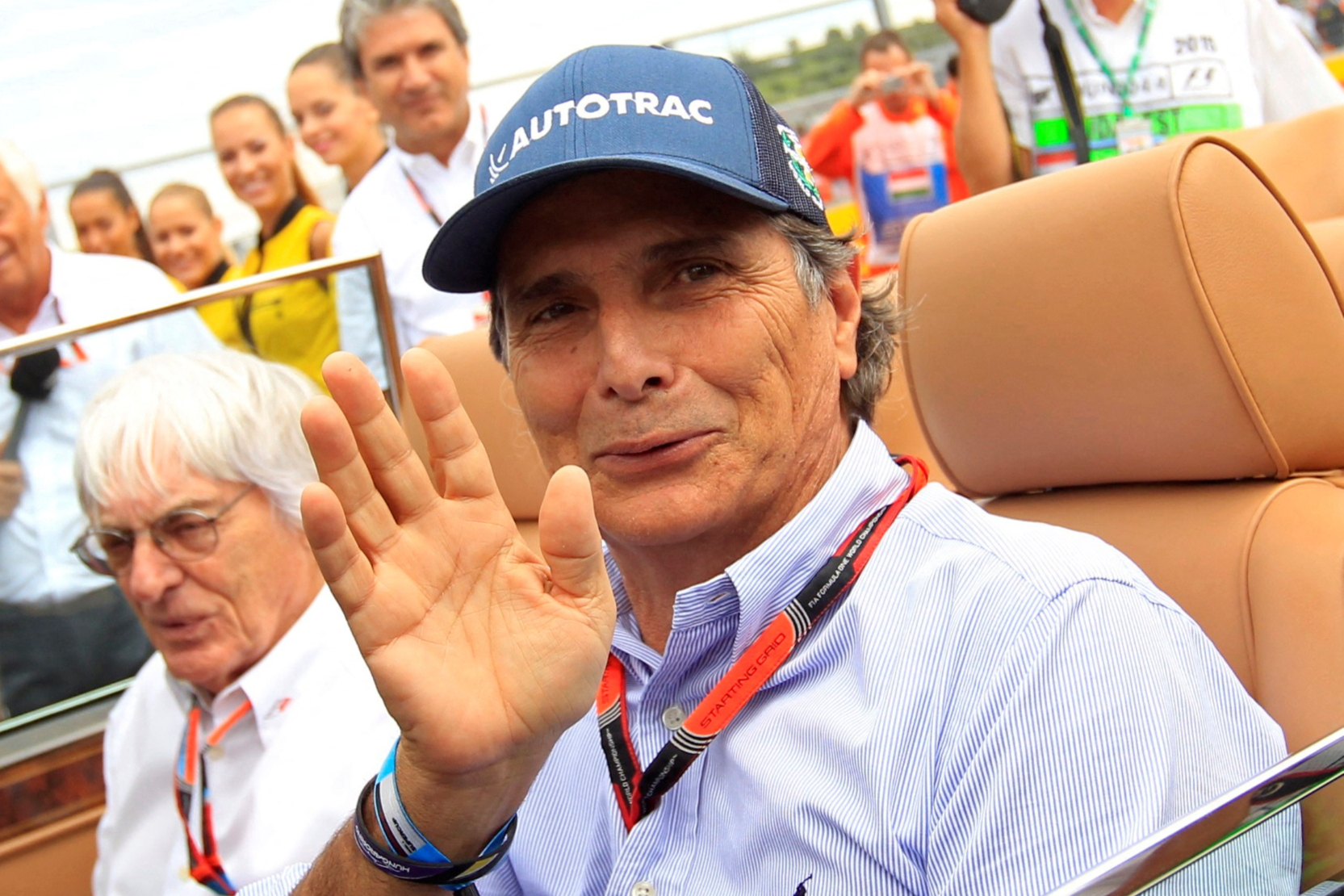 FILE PHOTO: Former Formula One driver Piquet of Brazil and Formula One supremo Ecclestone arrive at the drivers parade before the Hungarian F1 Grand Prix at the Hungaroring circuit, near Budapest