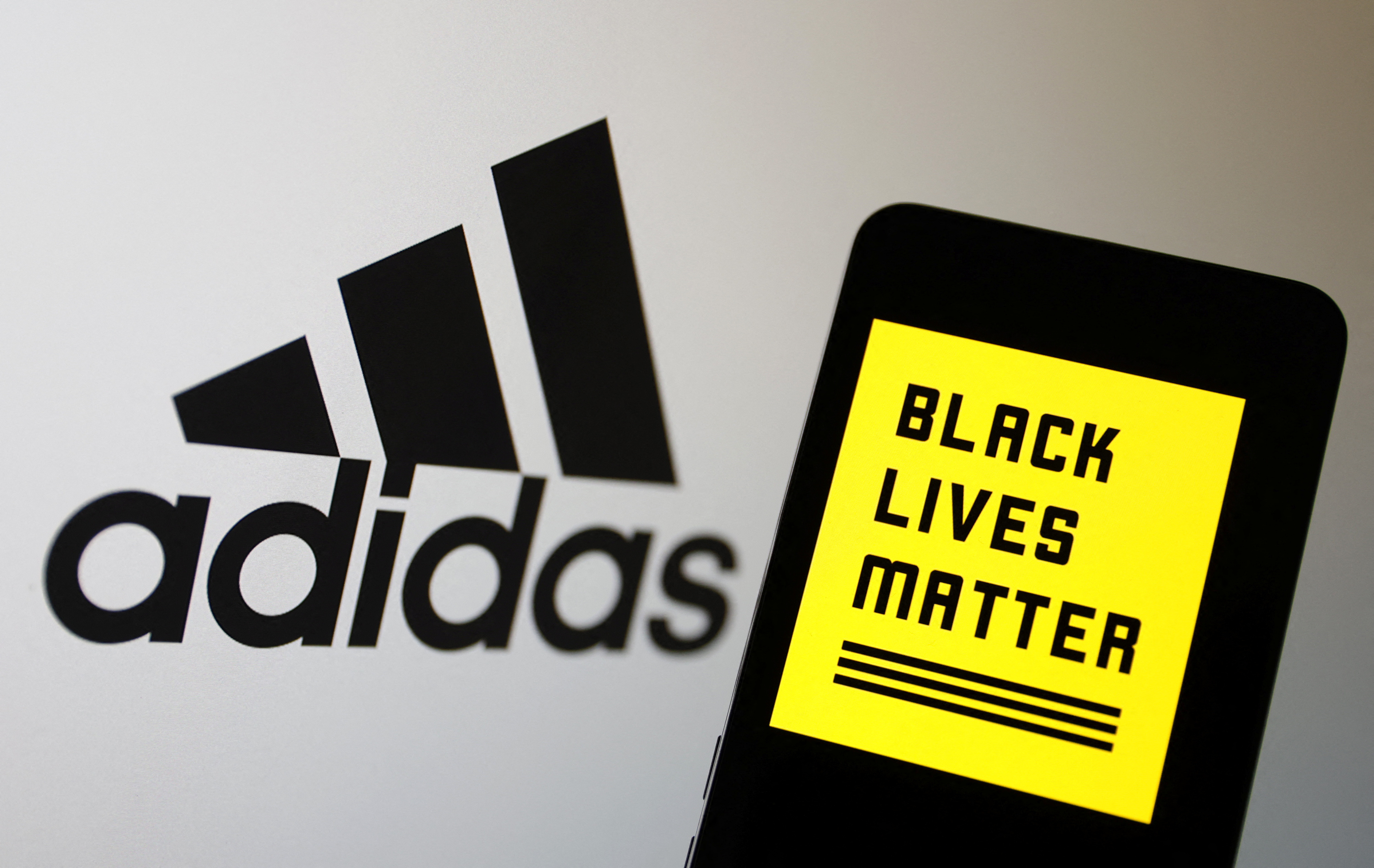 Illustration shows Adidas and Black Lives Matter logos
