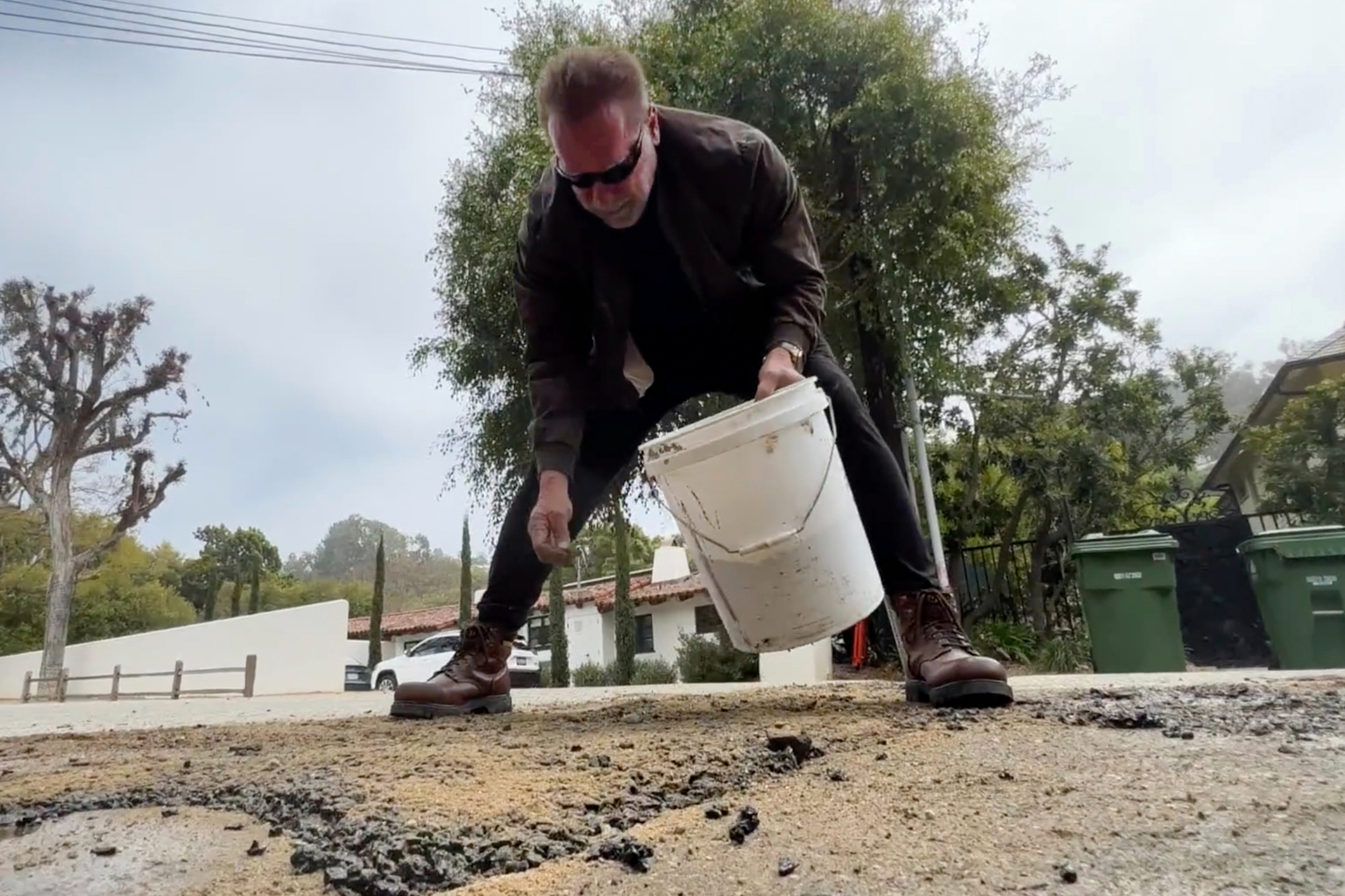 The Tar-minator: Arnie repairs pothole near LA home