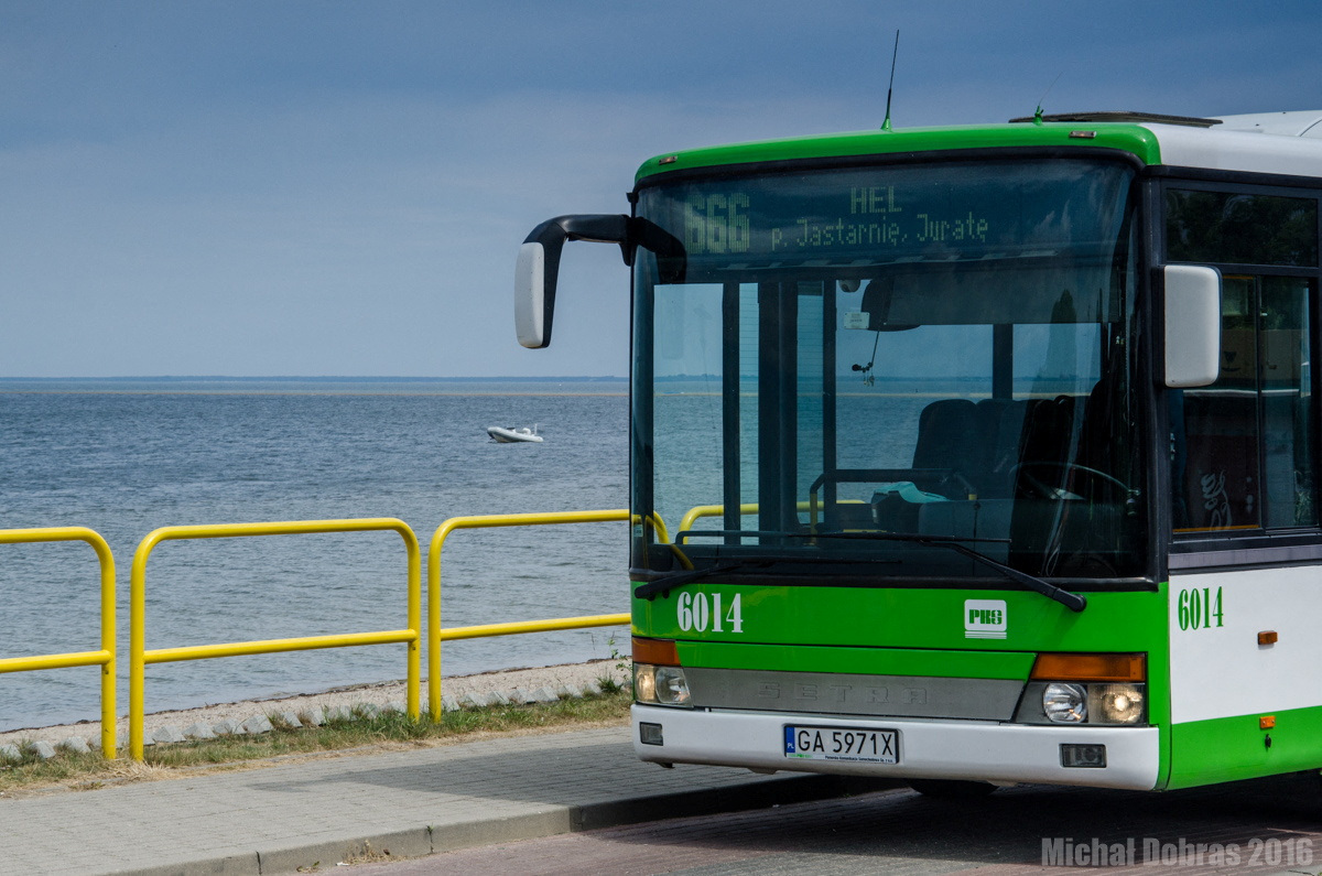 A local bus numbered 666, heading to Polish seaside resort Hel, is parked on the roadside in Rewa