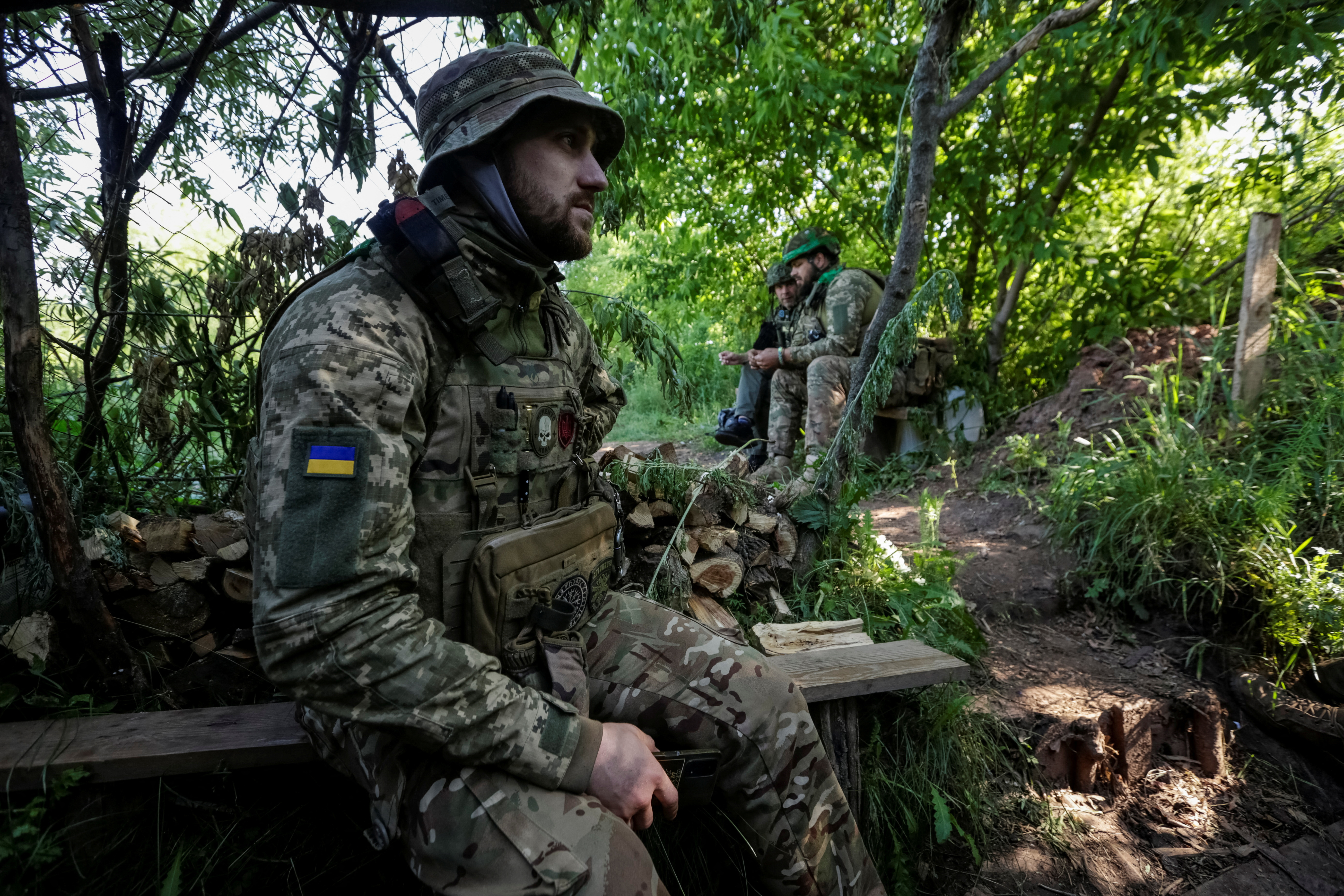 Ukrainian service members are seen on their position at a front line in Donetsk region