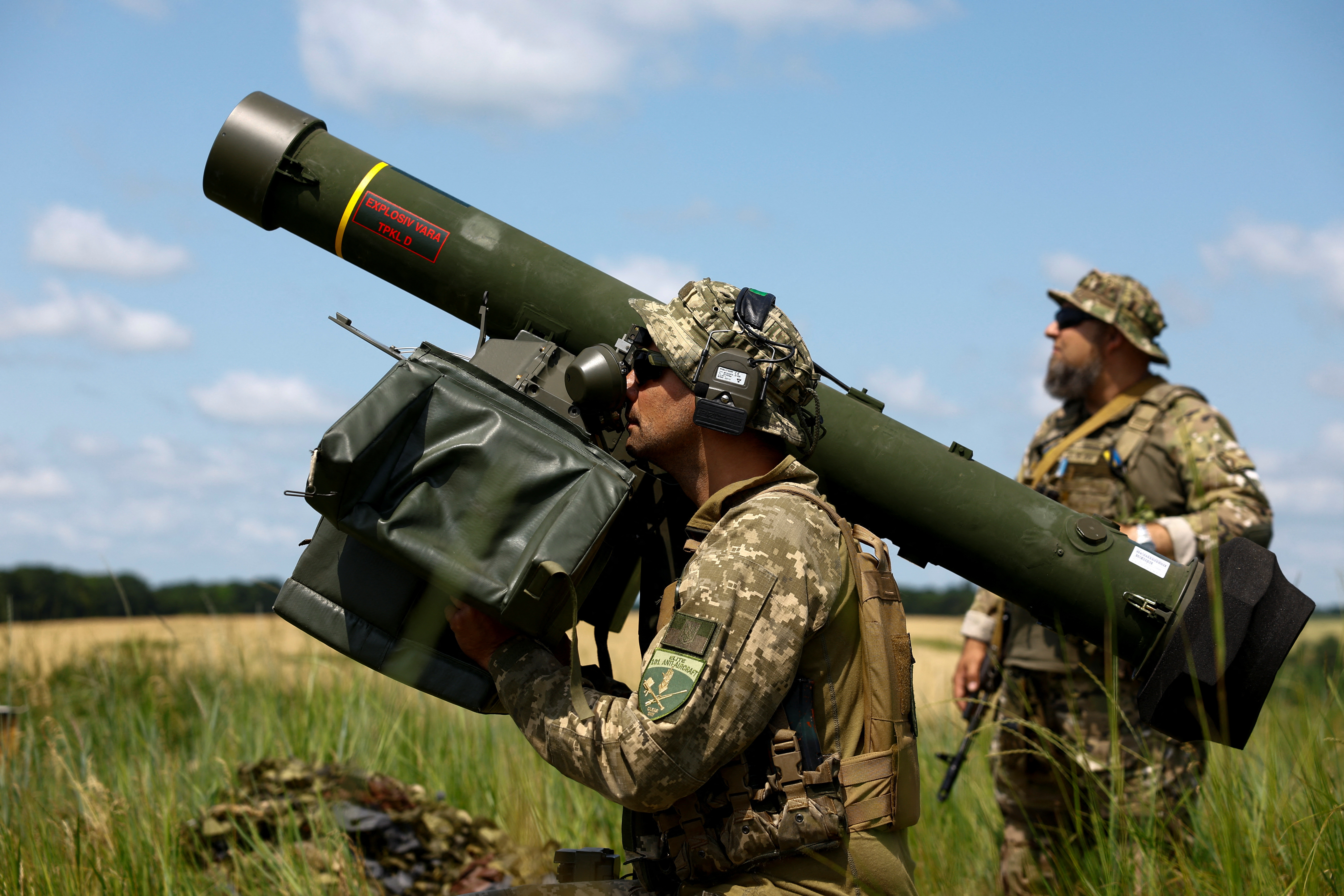 Ukrainian serviceman of an air defence unit operates a Swedish RBS 70 portable air-defence system during his combat shift in Kyiv region