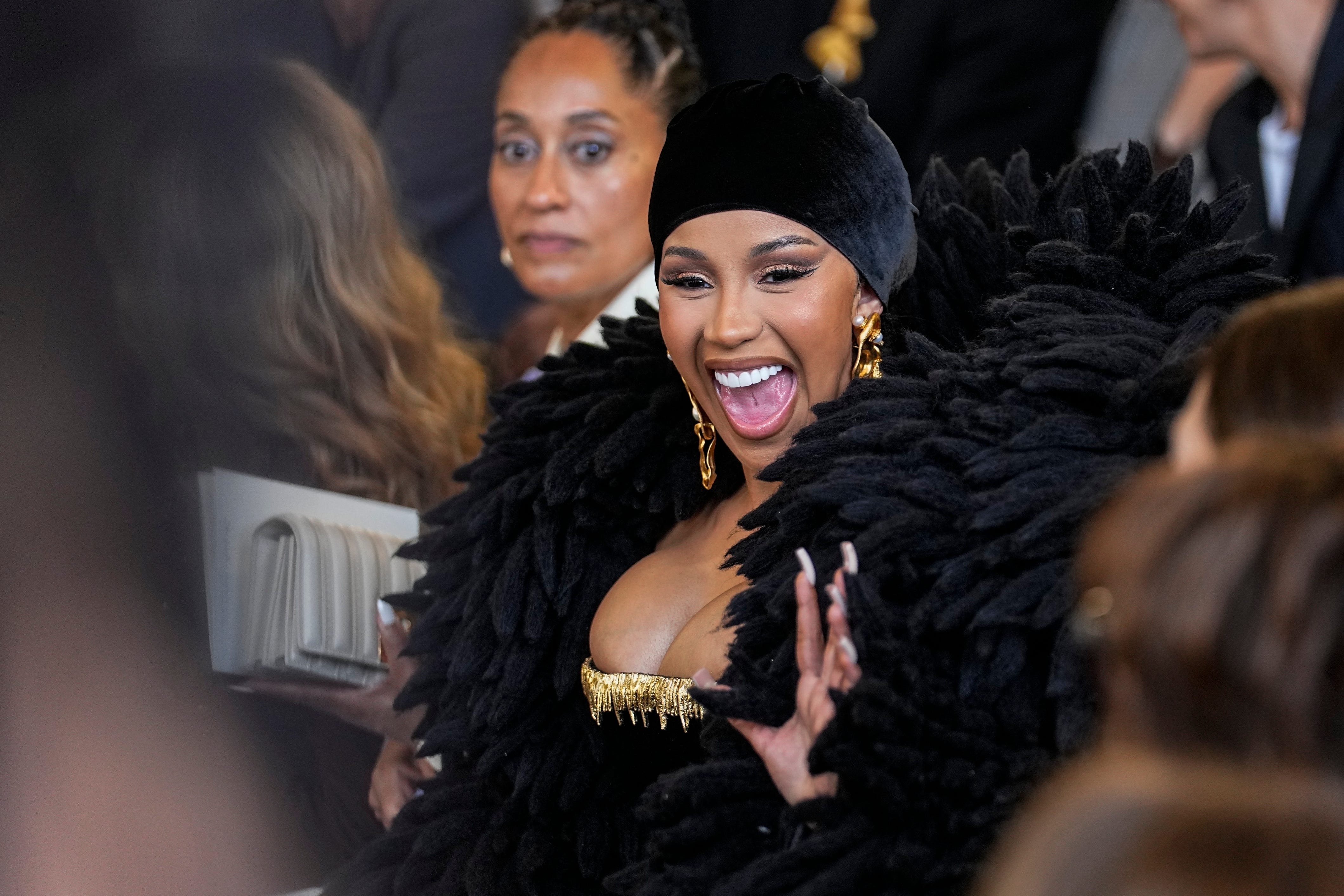 Cardi B dons dramatic feather-like bolero at Paris Fashion Week