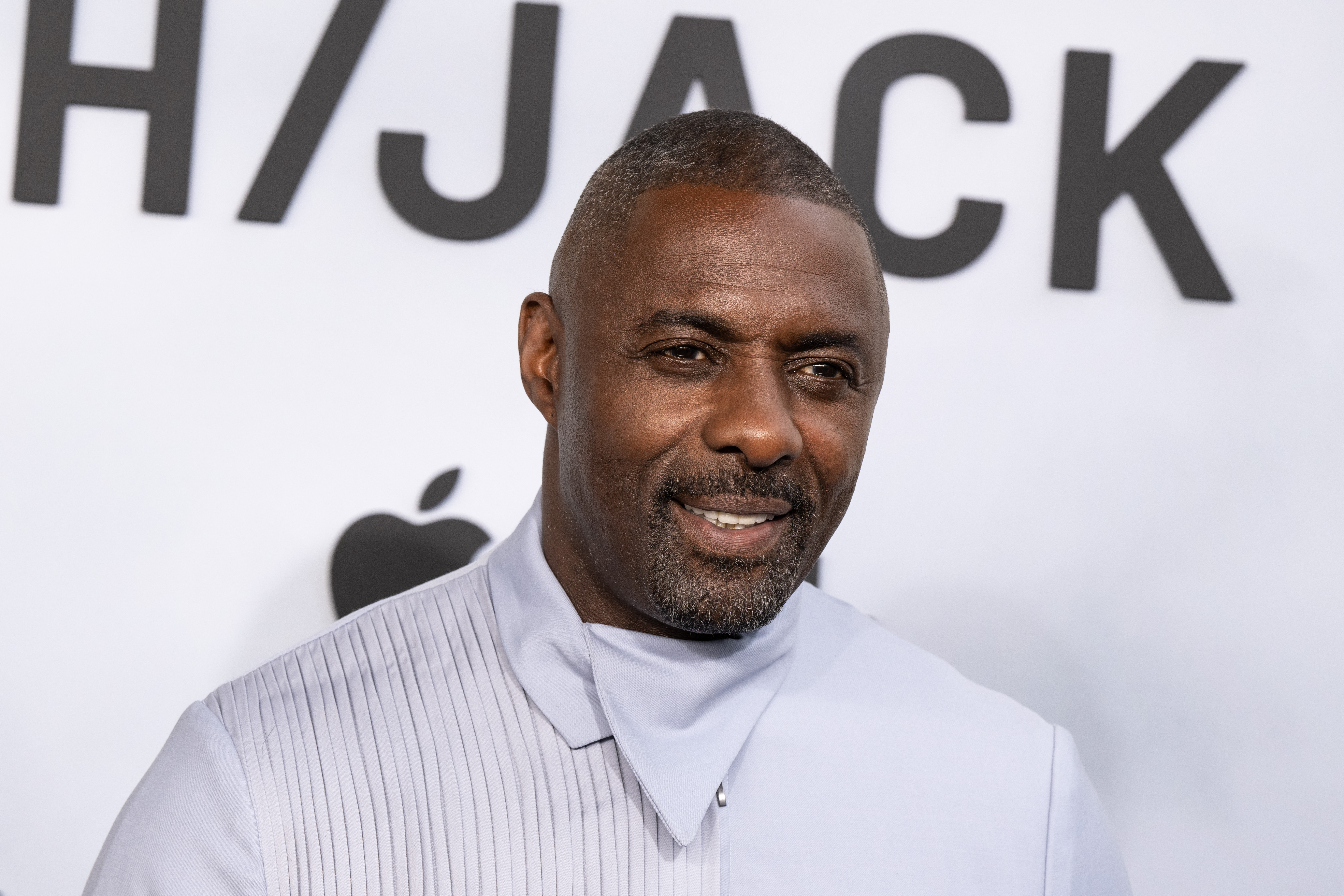 ‘They stuck it right in my face’: Idris Elba ‘nearly’ lost his life after being held at gunpoint in the US