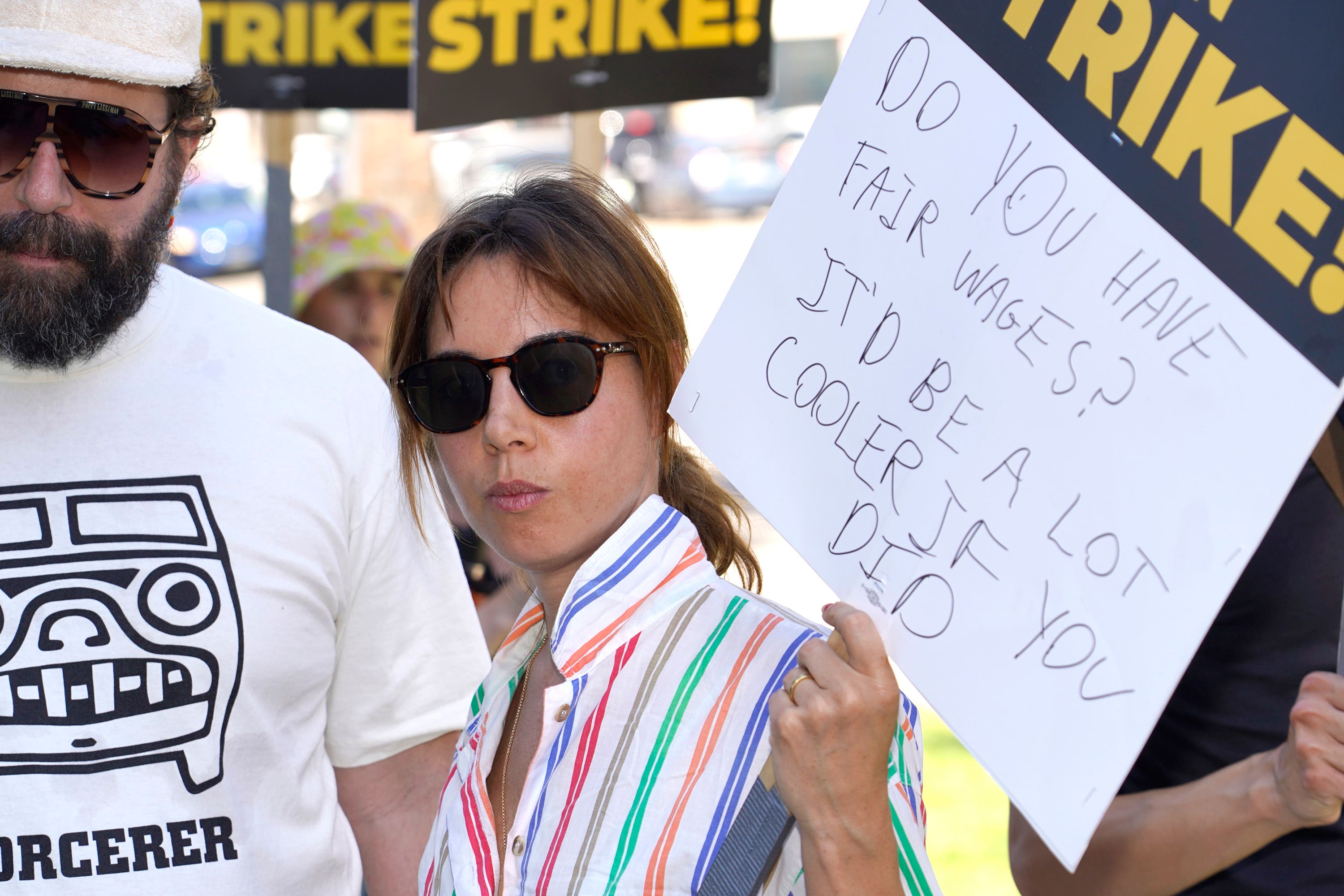 Cast of Parks And Recreation reunite on US picket line with four legged friend