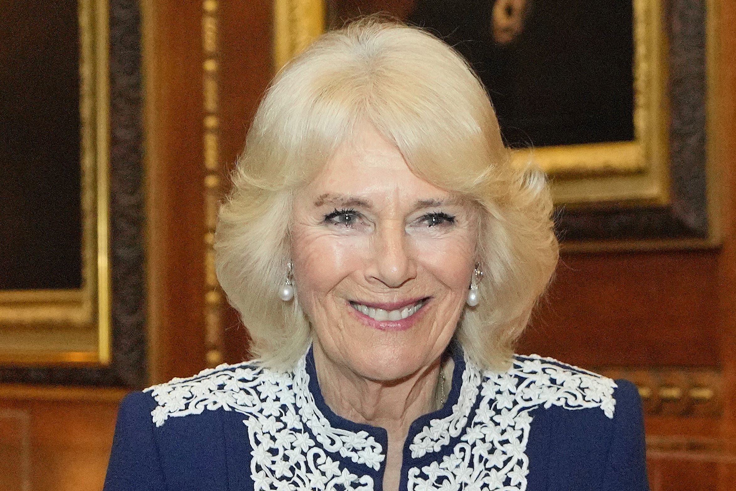 Camilla jokes about effect on sight of writing tiny book for royal dolls’ house