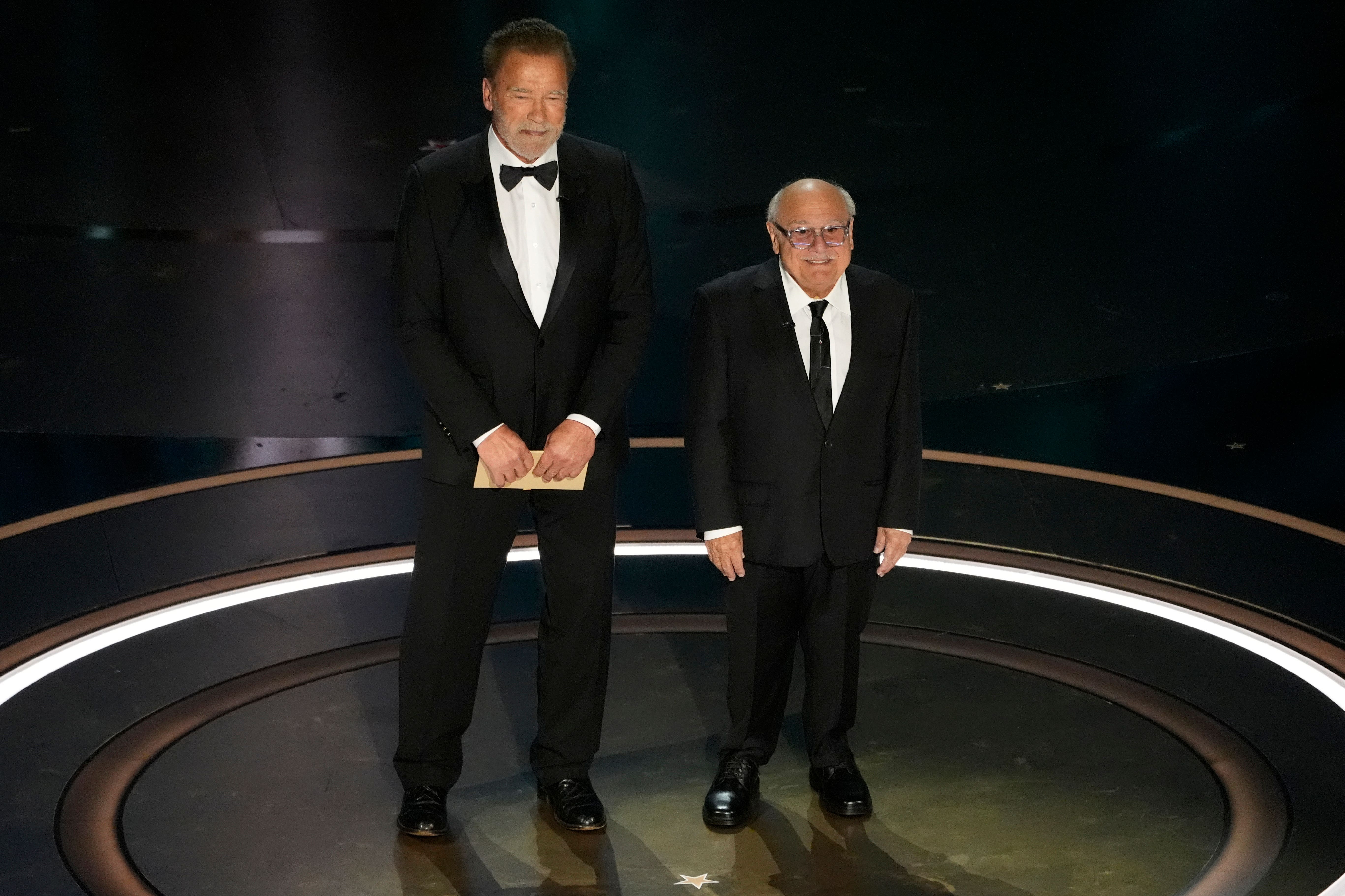 Twins stars and Batman villains Schwarzenegger and DeVito reunite at Oscars