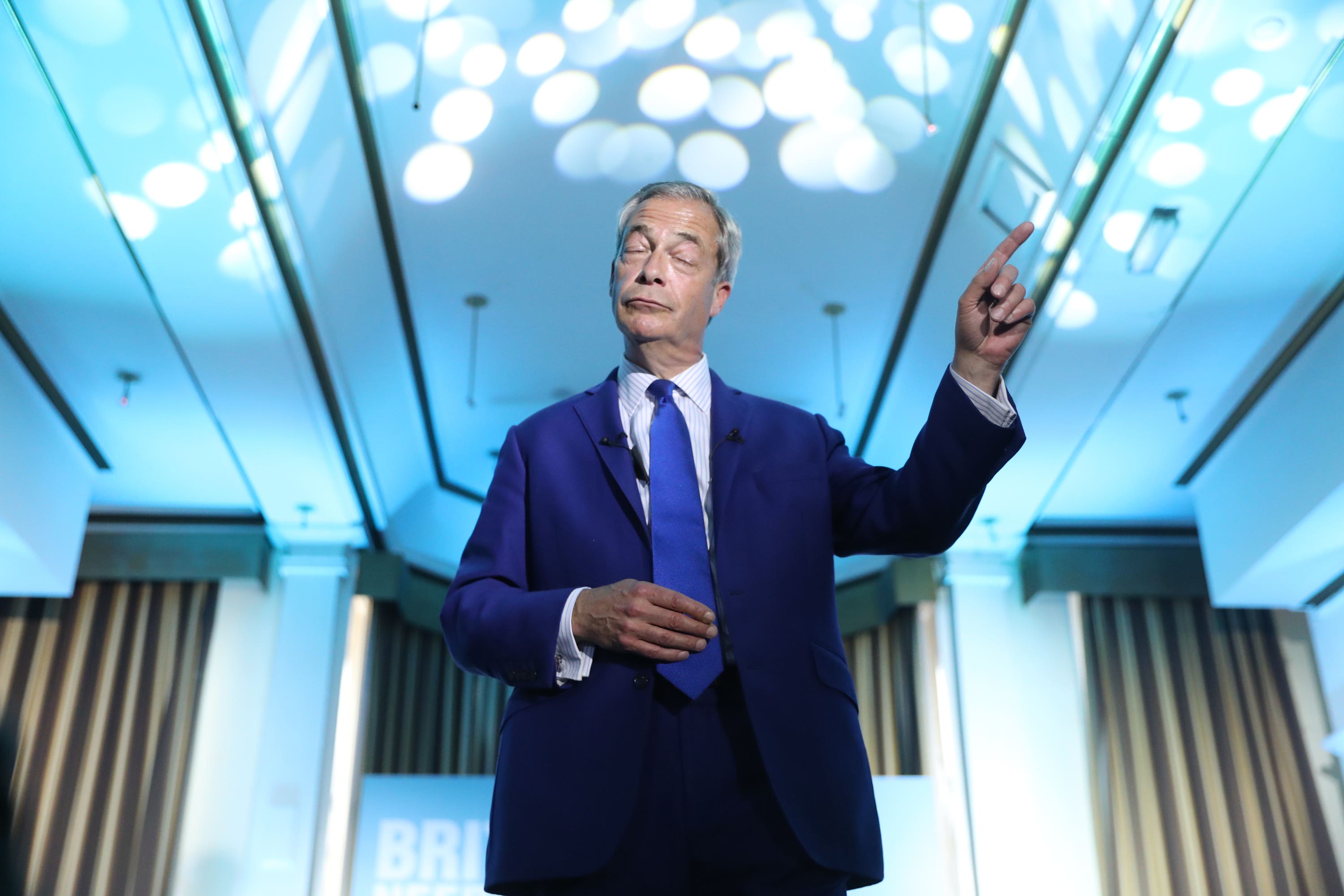 Nigel Farage sings along to Eminem on stage in Blackpool