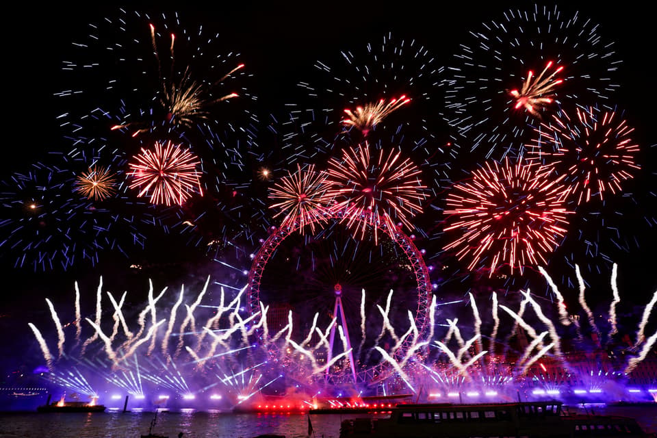 Fireworks explode over the London Eye Ferris wheel, in London,