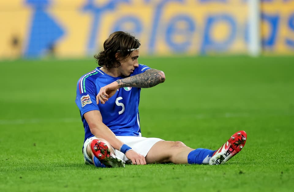 Arsenal defender Riccardo Calafiori sits injured during Italy's Nations League match against Germany