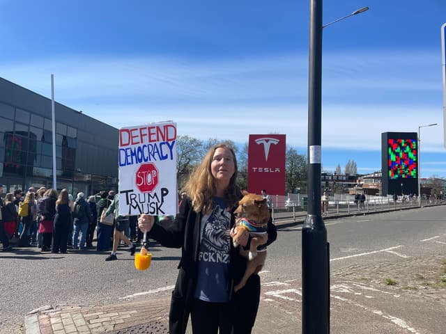 Woman protesting Tesla
