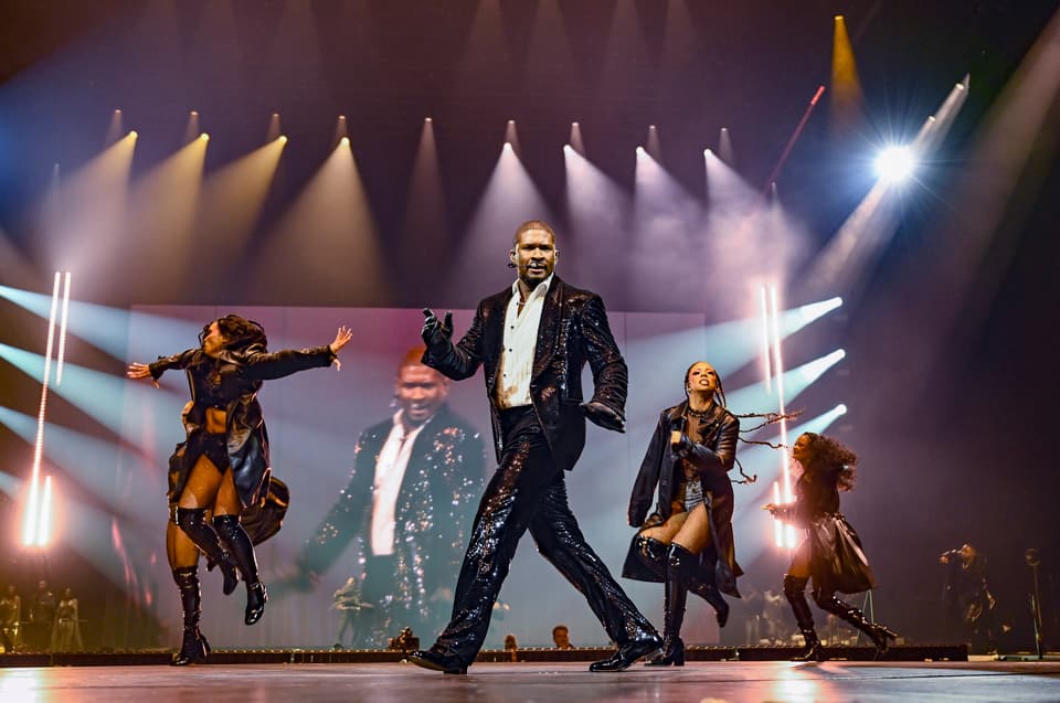 Usher performs on stage at The O2 Arena on March 29, 2025