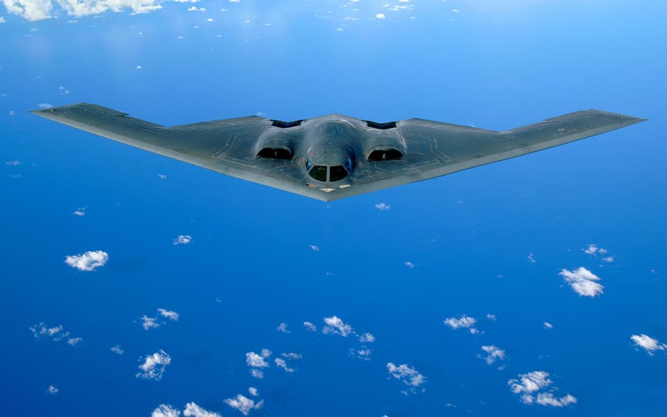 A U.S. Air Force B-2 Spirit stealth bomber aircraft in flight after a refueling mission May 30, 2006 over the Pacific Ocean. (photo by Bennie J. Davis III /U.S. Air Force via Planetpix)