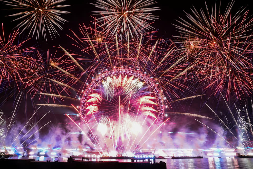 Fireworks explode over the London Eye Ferris wheel to mark the New Year's celebrations, in London