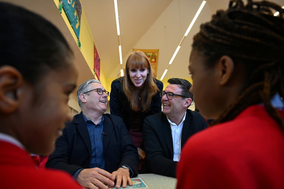 Sir Keir Starmer, Angela Rayner and Andy Burnham put on a united front on a visit to a school in Ashton-under-Lyne ahead of local elections in May (Paul Ellis/PA)