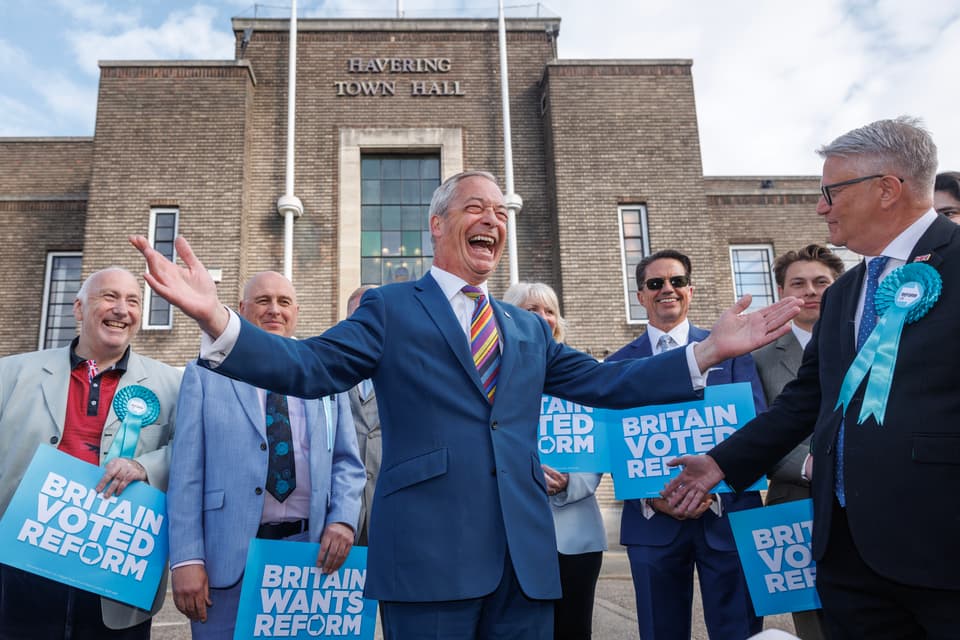 <p>ROMFORD, ENGLAND - MAY 08: Reform UK leader Nigel Farage poses with winning councillors outside Havering Town Hall following the 2026 local election results on May 08, 2026 in Romford, England. Voters went to the polls yesterday in the local elections across England. Results counted overnight show widespread losses for the Labour Party. Several key Labour councils have surrendered their majority as Reform UK and the Liberal Democrats make significant gains. (Photo by Dan Kitwood/Getty Images)</p>