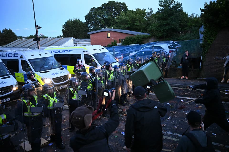 Protesters hurl bins at riot police as the protest descended into violence 