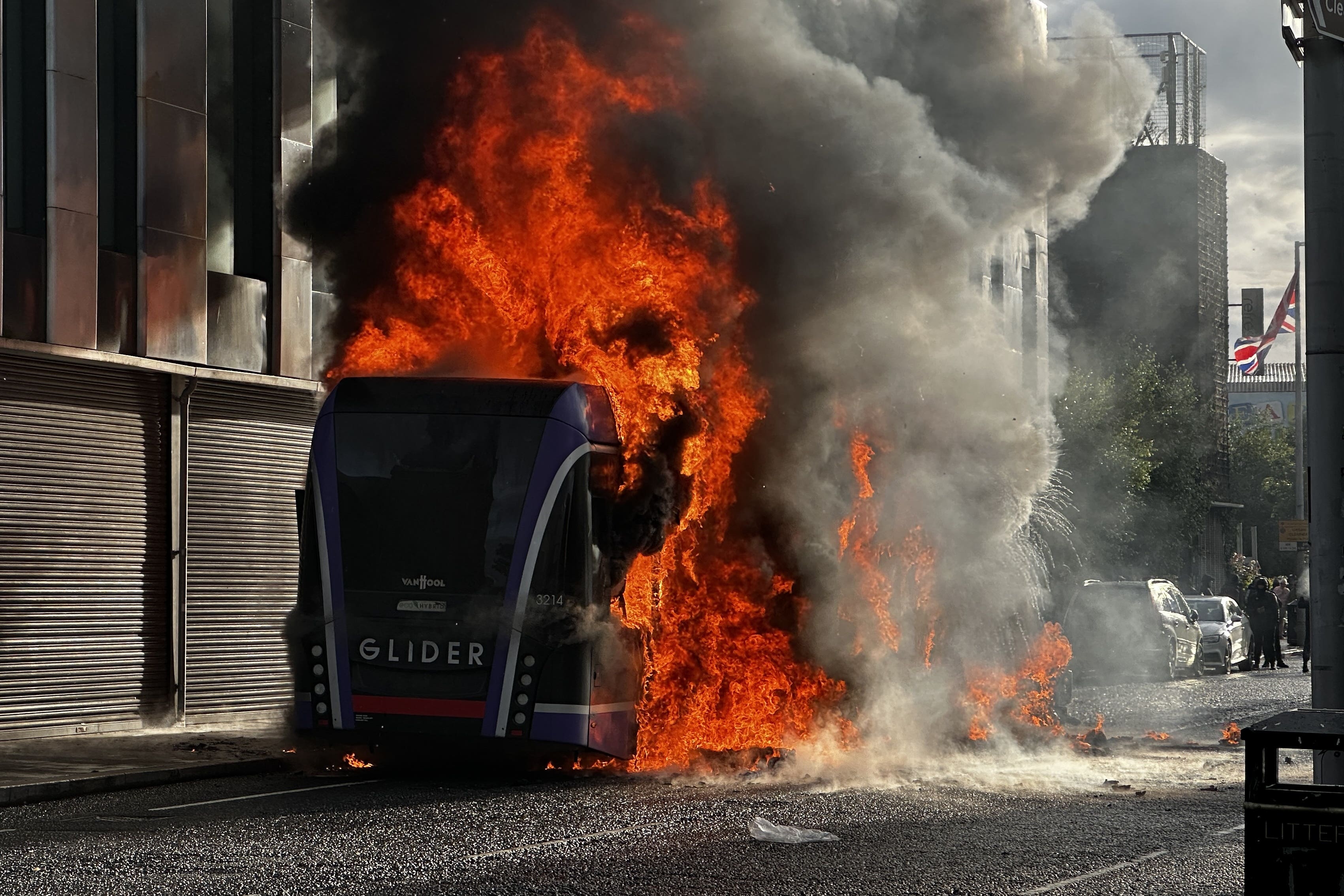 Bus set alight by masked protesters as police dealing with ‘pockets of disorder’