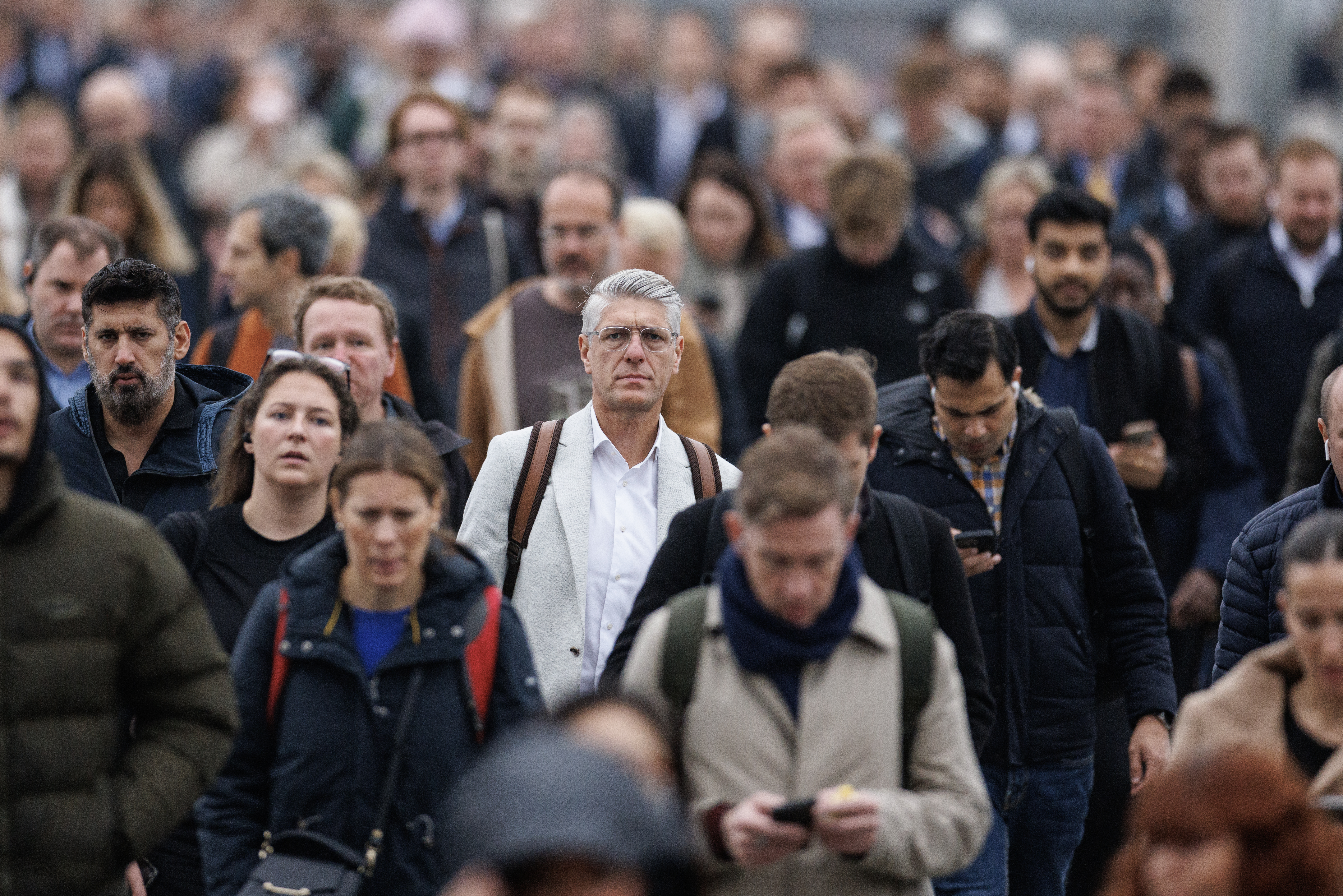 Commuters cross London Bridge on October 15, 2024