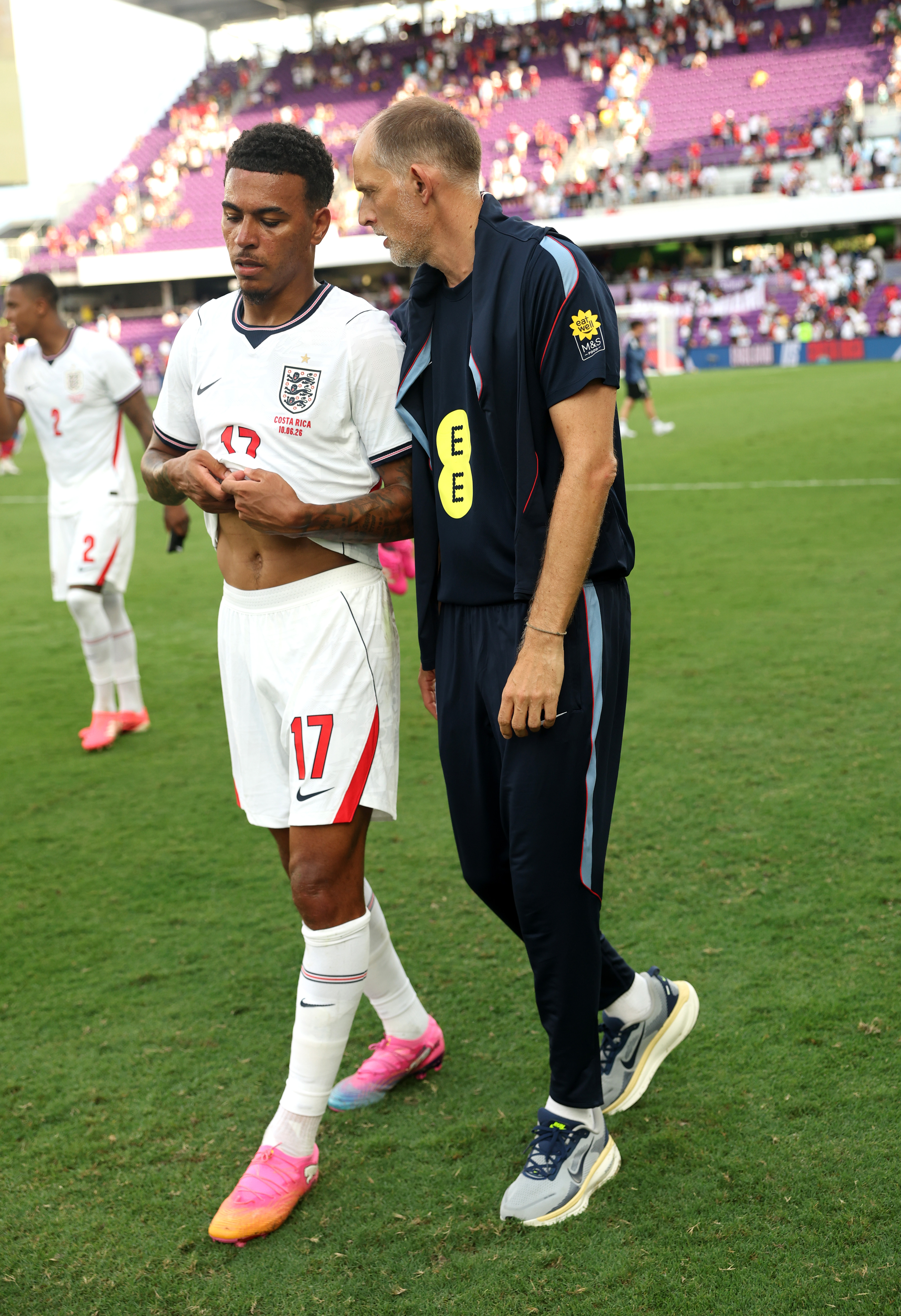 ORLANDO, FLORIDA - JUNE 10: Thomas Tuchel, Manager of England, speaks to Morgan Rogers #17 of England following victory at the end of the International Friendly match between England and Costa Rica at Inter&Co Stadium on June 10, 2026 in Orlando, Florida. (Photo by Eddie Keogh - The FA/The FA via Getty Images)