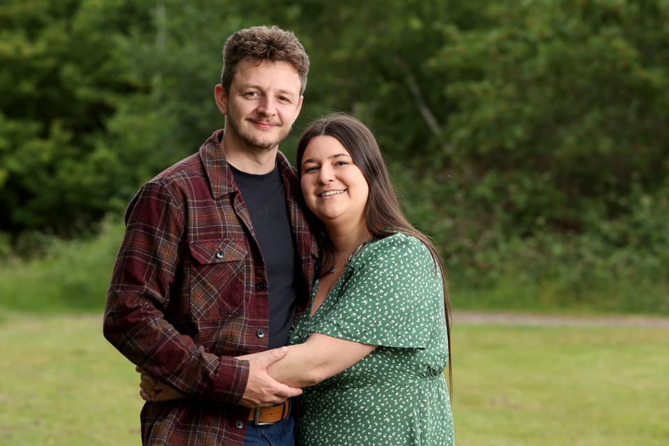<p>EMBARGOED TO 0001 THURSDAY JUNE 18 Tom Atkins and Amy Govier at Westlands Playpark, Colchester, Essex. Their son Elliot was about to be placed on a palliative care pathway when his family were offered a never-before-performed intervention in children with heart failure, by specialists at Great Ormond Street Hospital (GOSH). The intervention, called an angioplasty, would widen his blood vessels and improve his blood pressure control, helping his heart grow strong enough to eventually have vital surgery. Picture date: Friday June 5, 2026.</p>