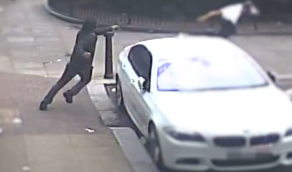 <p>Moment Aderahman Boumzough, 25, tries to shoot a second victim in the street after killing  Rene Graham, 15   </p>