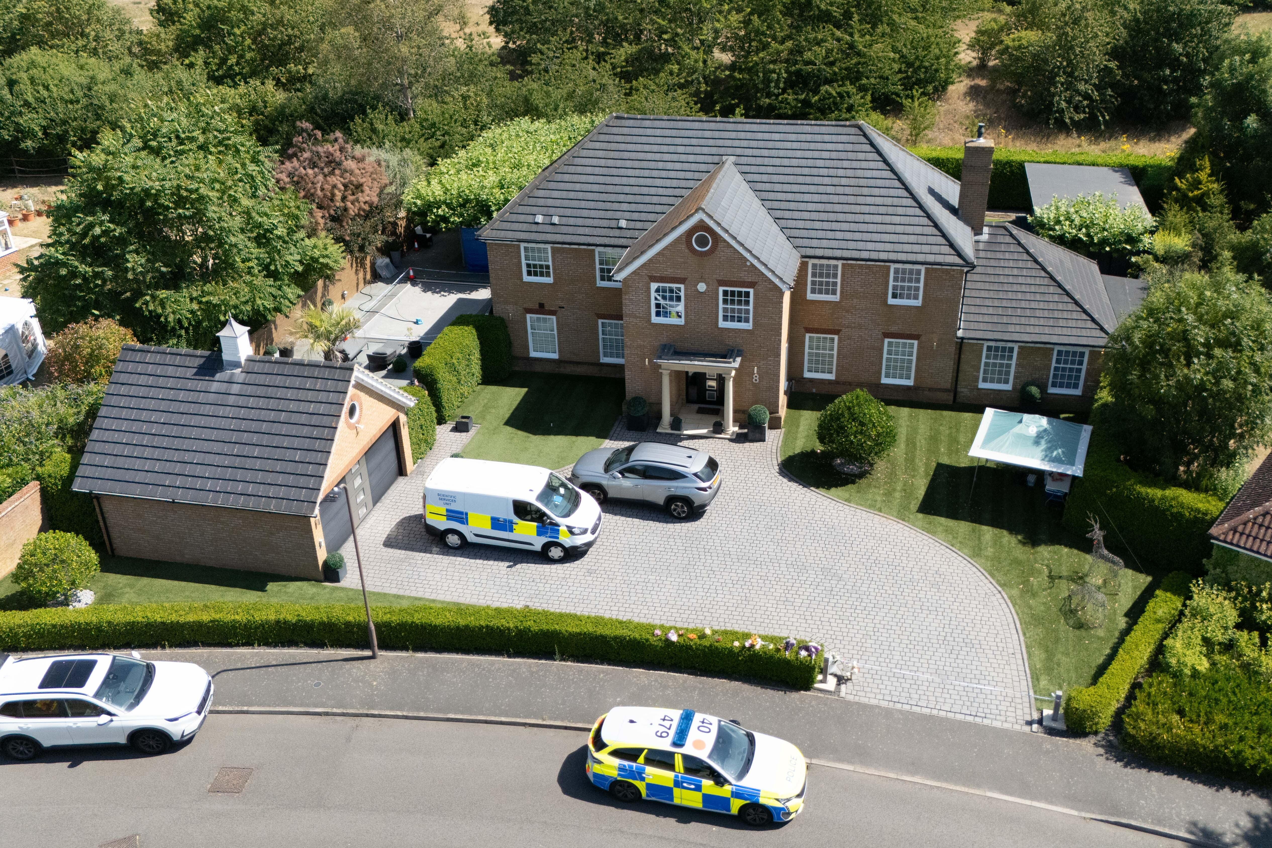 Hunt for man after wife and two daughters found dead at home