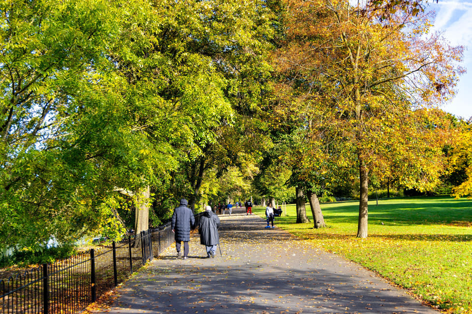 People walking in Valentines Park in fall, Redbridge, Ilford, England
