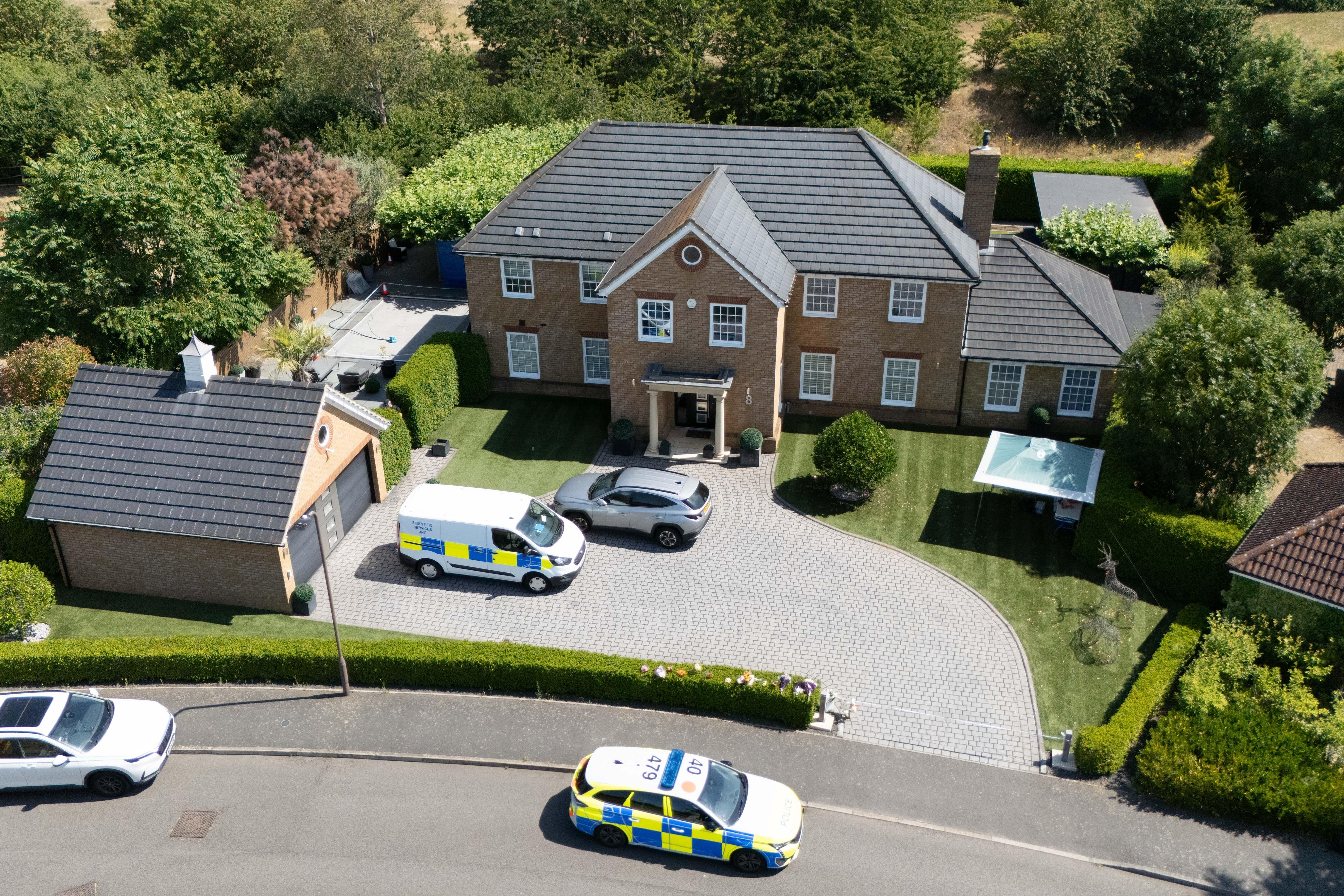 Man wanted over death of wife and daughters in Britain arrested in South Africa