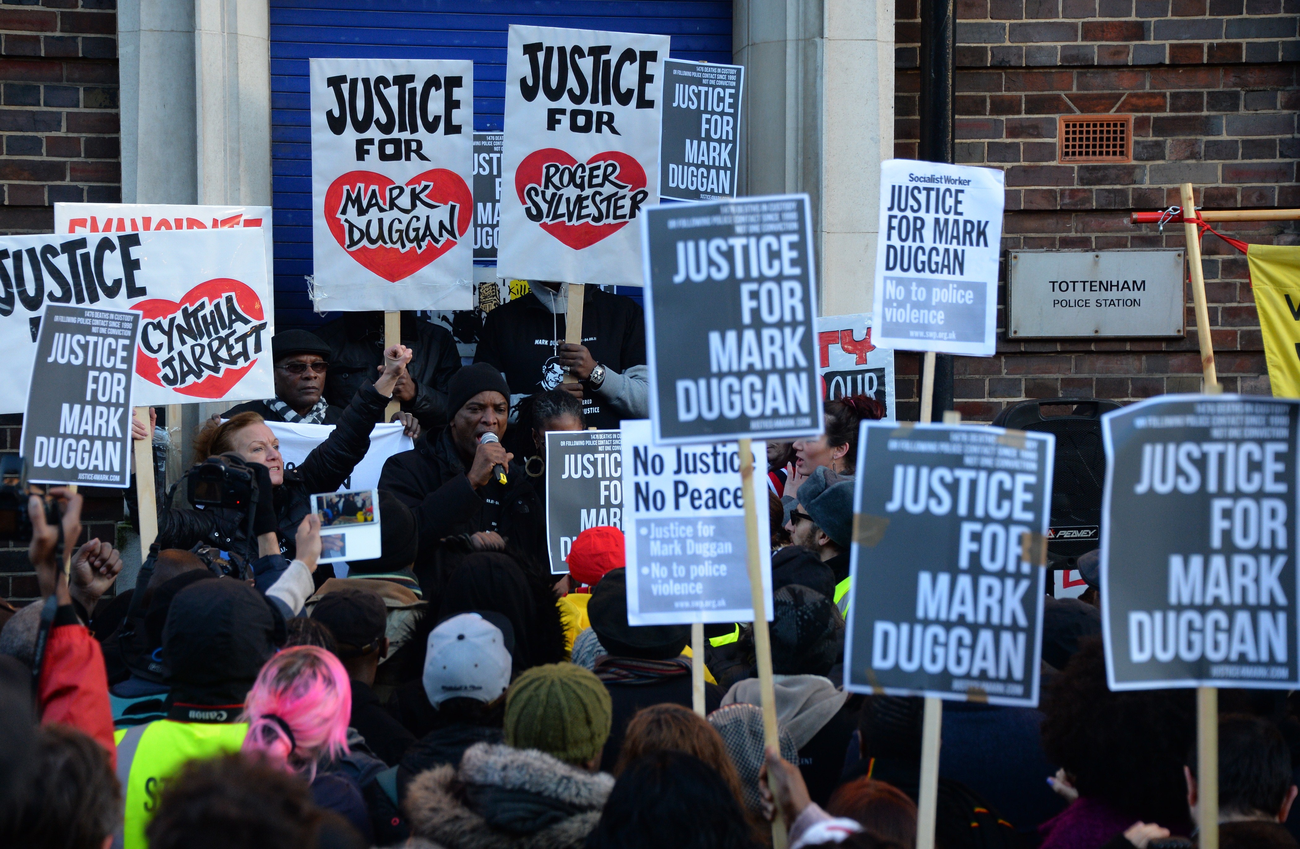 Hundreds of people gather at Tottenham police station for Mark Duggan 