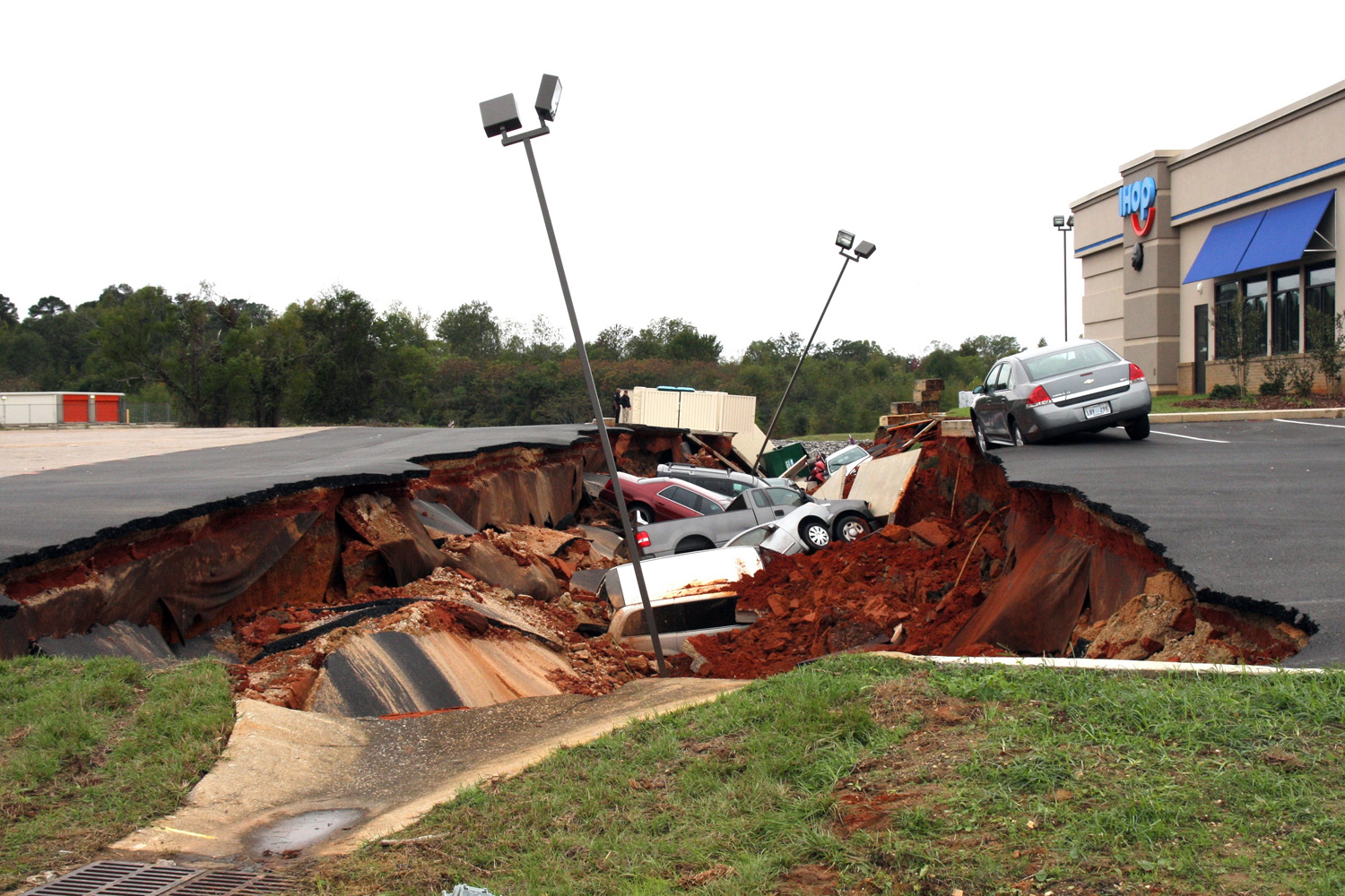 Cars swallowed by 'sinkhole' in US