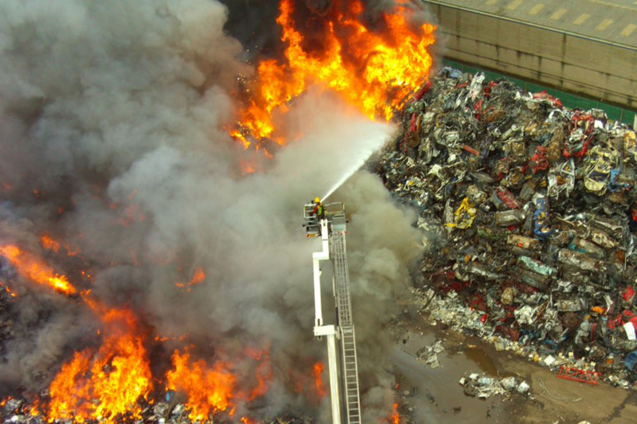 Footage shows fire crews battling huge blaze at recycling centre
