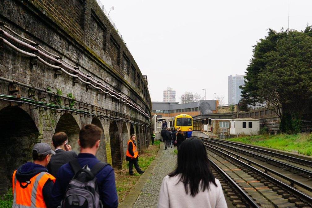 Rush hour commuters evacuated from packed trains after power failure