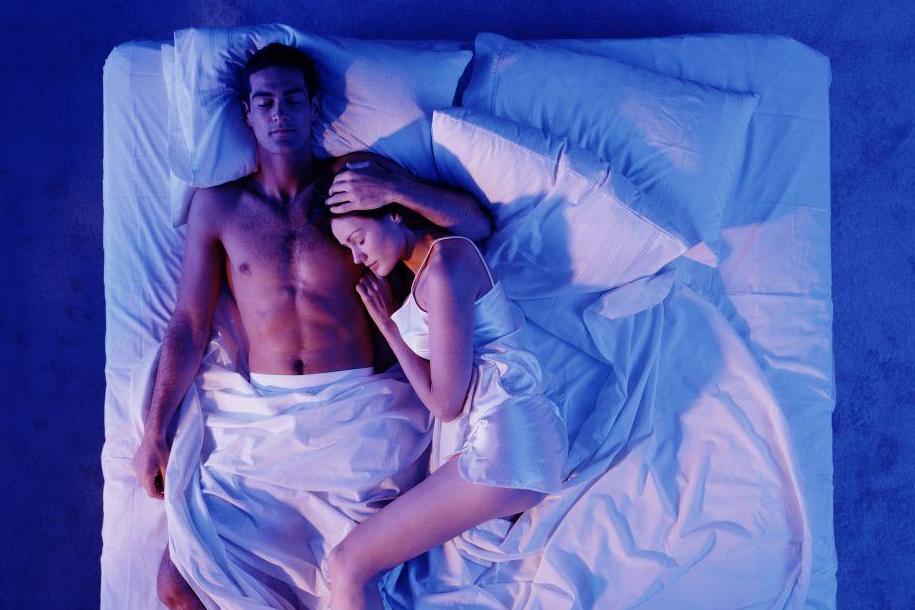 Man and woman in bed sleeping