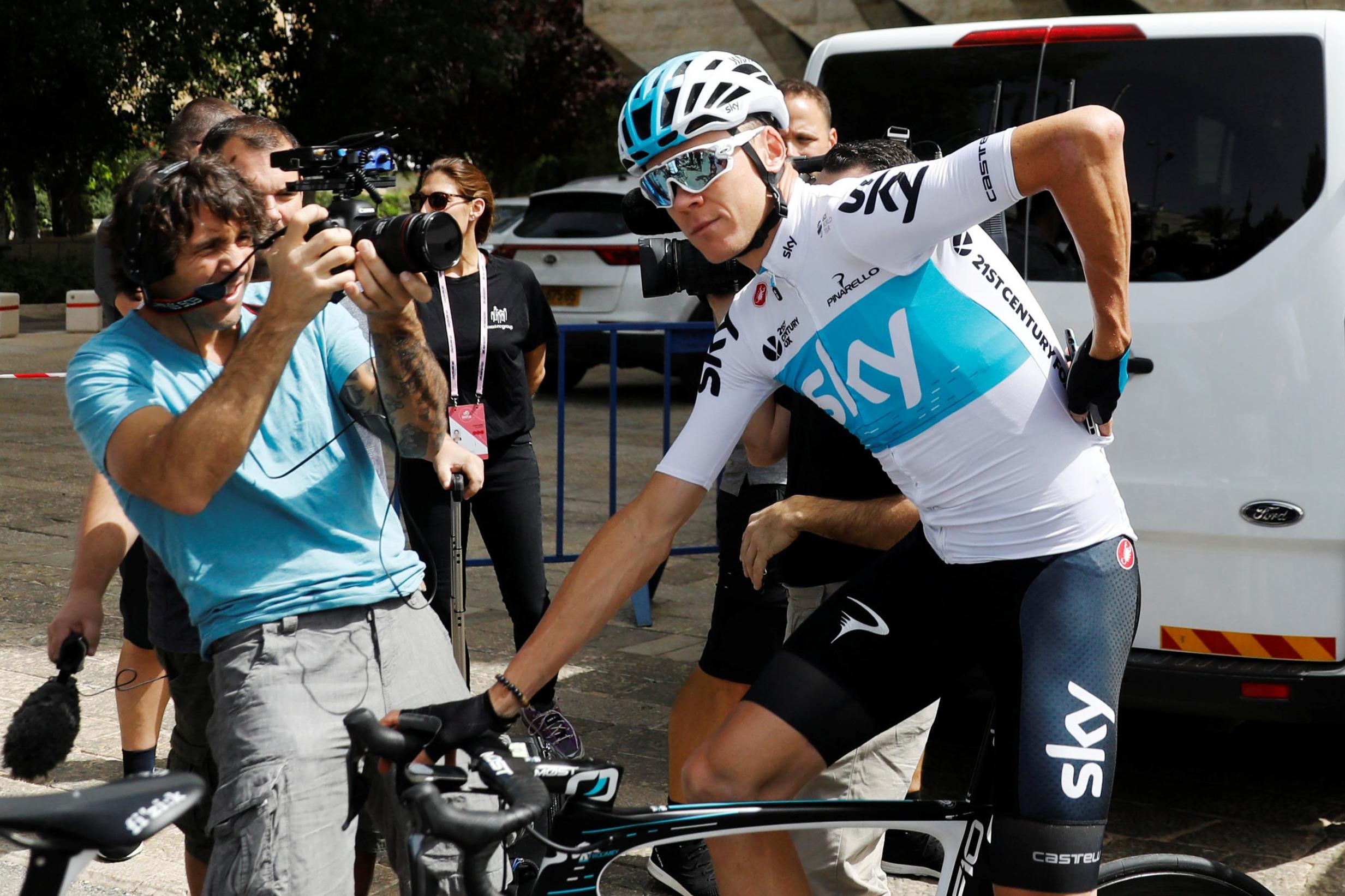 Froome races under a cloud but rivals are reluctant to speak out