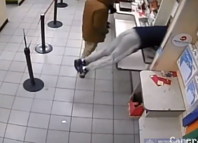Moment crooks hurtle through post office parcel hatch to steal cash