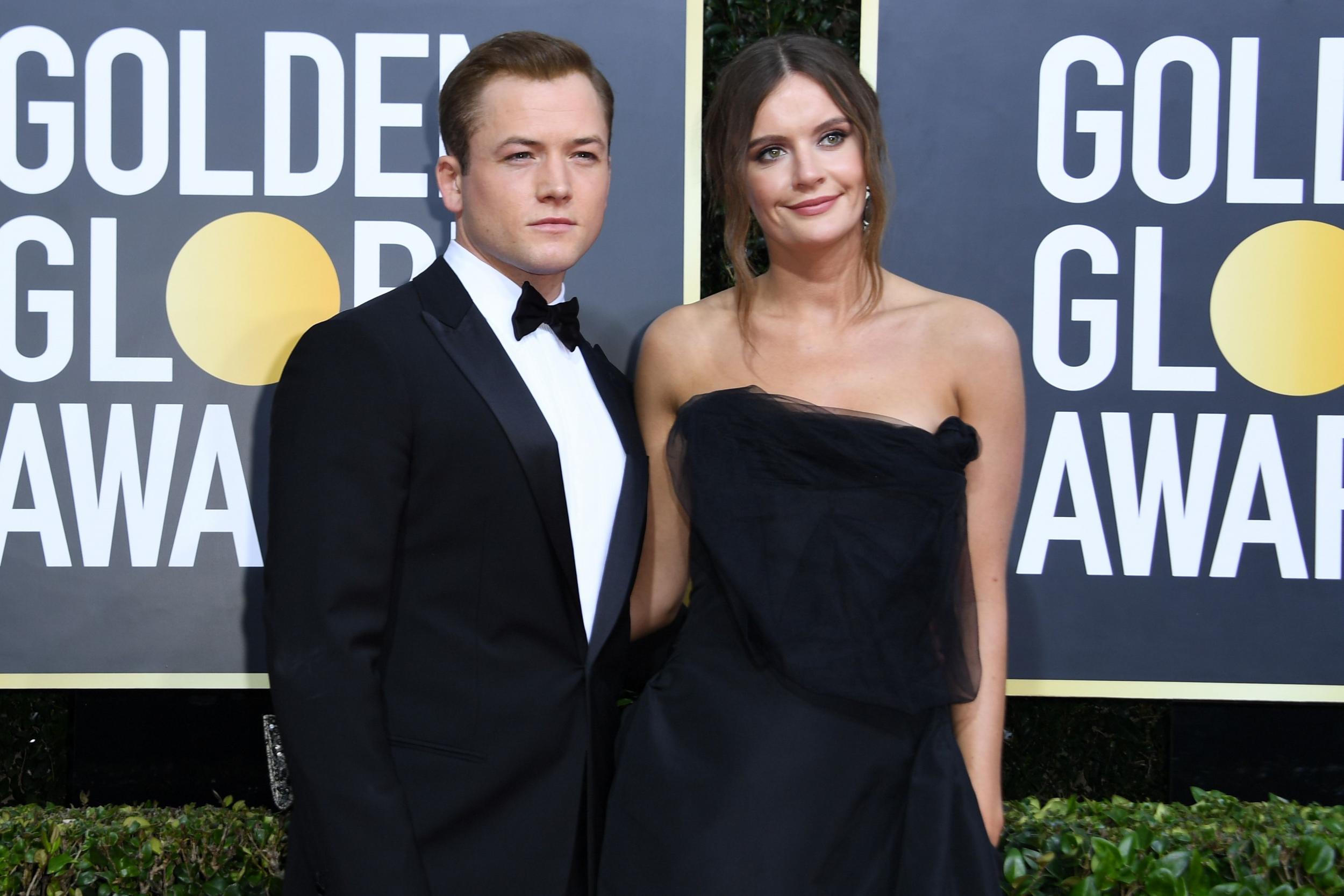 Taron Egerton and girlfriend Emily Thomas attend Golden Globes