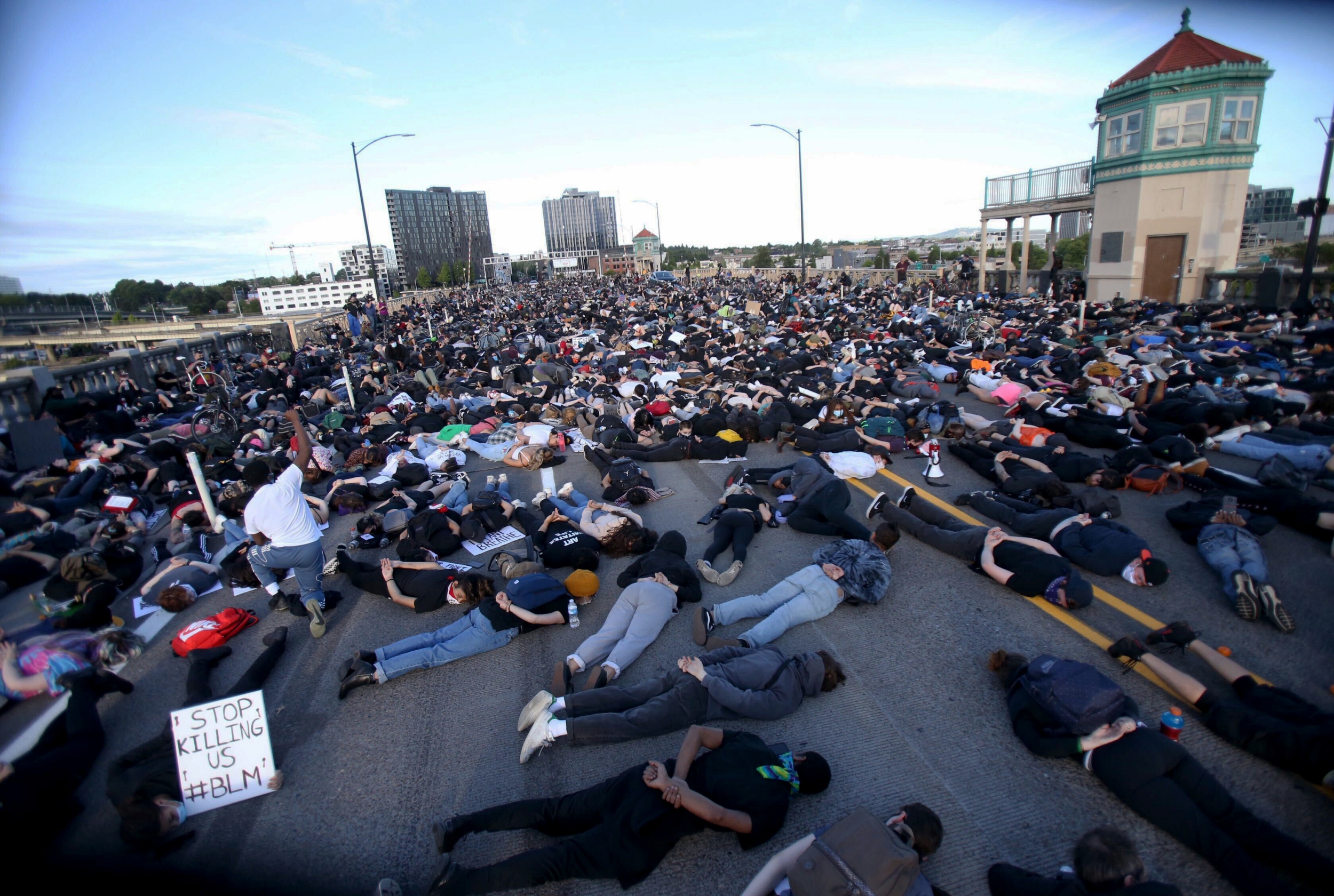 Protesters stage mass 'lie-in' on US bridge in tribute to George Floyd