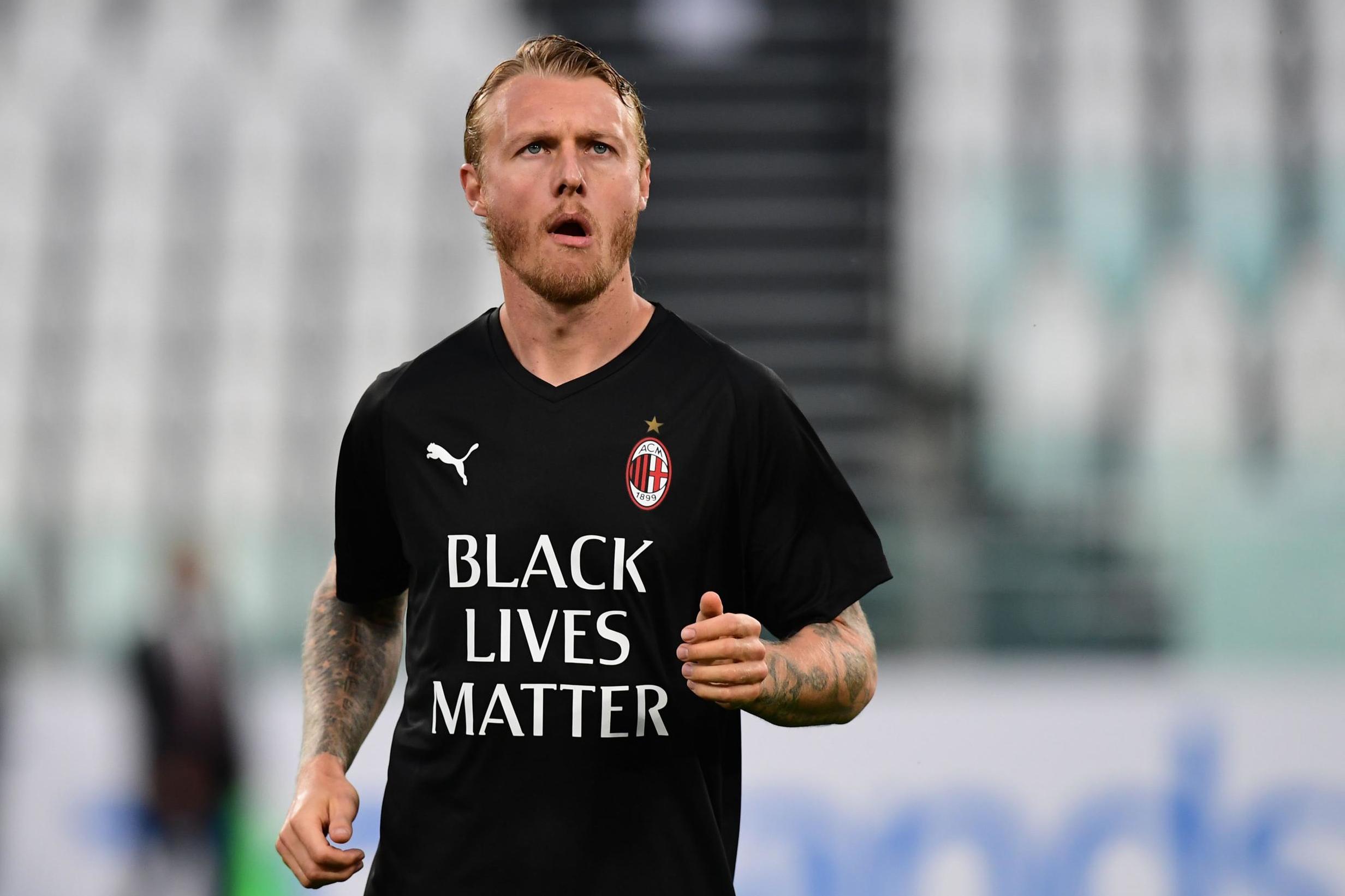 Juventus and AC Milan players wear anti-racism shirts before cup tie