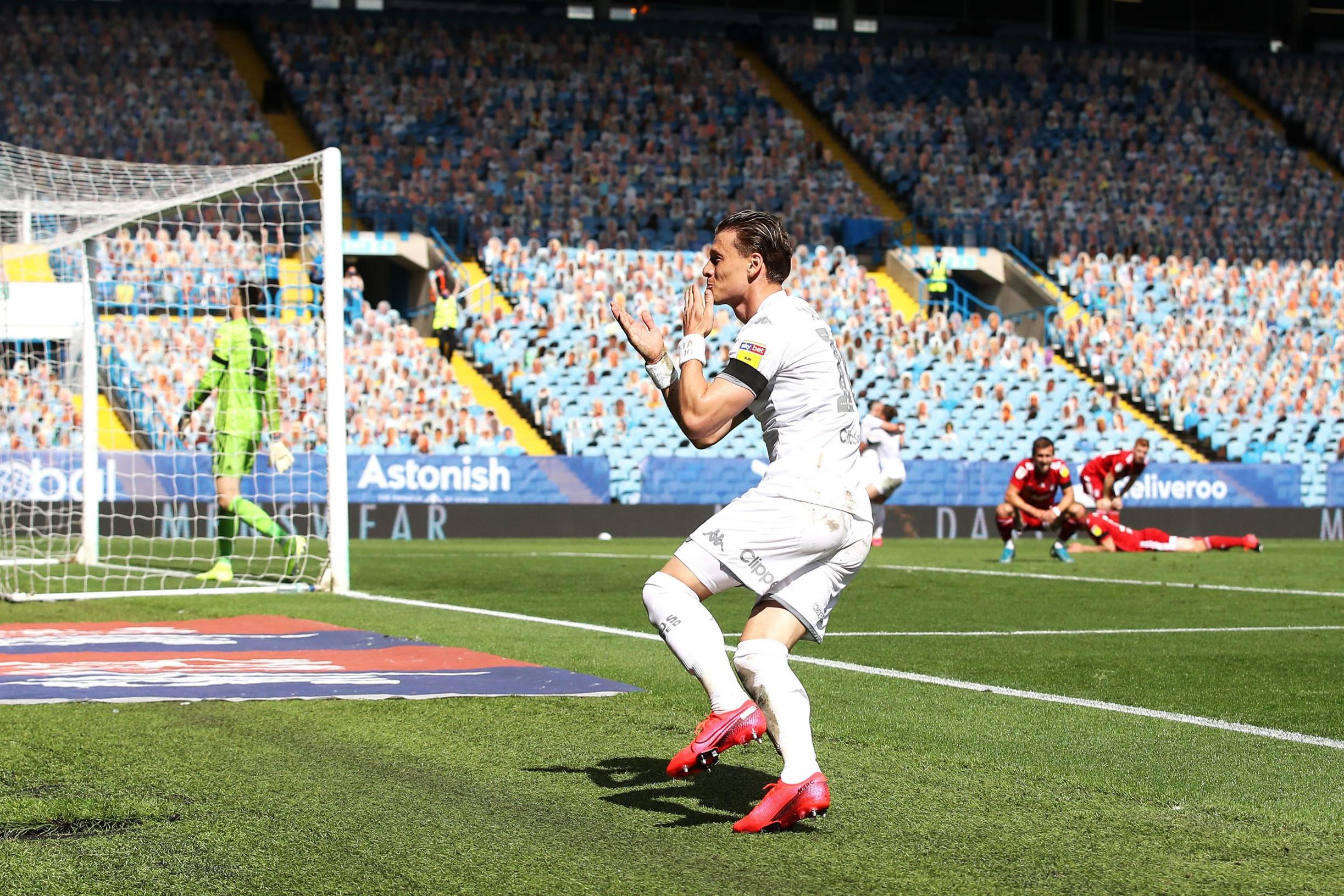 Leaders Leeds earn crucial win over 10-man Fulham in promotion race